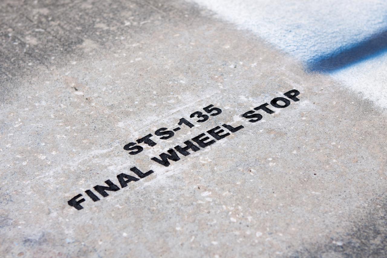 CAPE CANAVERAL, Fla. - At the Shuttle Landing Facility SLF at NASA’s Kennedy Space Center in Florida, the final wheel stop of an orbiter is marked. Space shuttle Atlantis completed the STS-135 mission by landing at the SLF on July 21, 2011, at 5:57 a.m. A special plaque will be permanently mounted at the runway’s edge to commemorate the final shuttle landing. Atlantis flew 33 missions, completed 4,848 orbits of the Earth, traveled nearly 126 million miles and spent 307 days in space. Atlantis carried 207 astronauts to space. Photo credit: NASA/Jim Grossmann