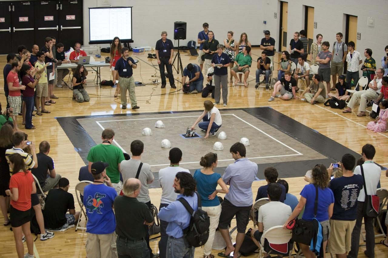 MELBOURNE, Fla. – Students and faculty watch as a robot takes part in a competition during the International Space University's Space Studies Program 2012 session inside a gymnasium at the Florida Institute of Technology in Melbourne, Fla. Photo credit: NASA/Dmitri Gerondidakis