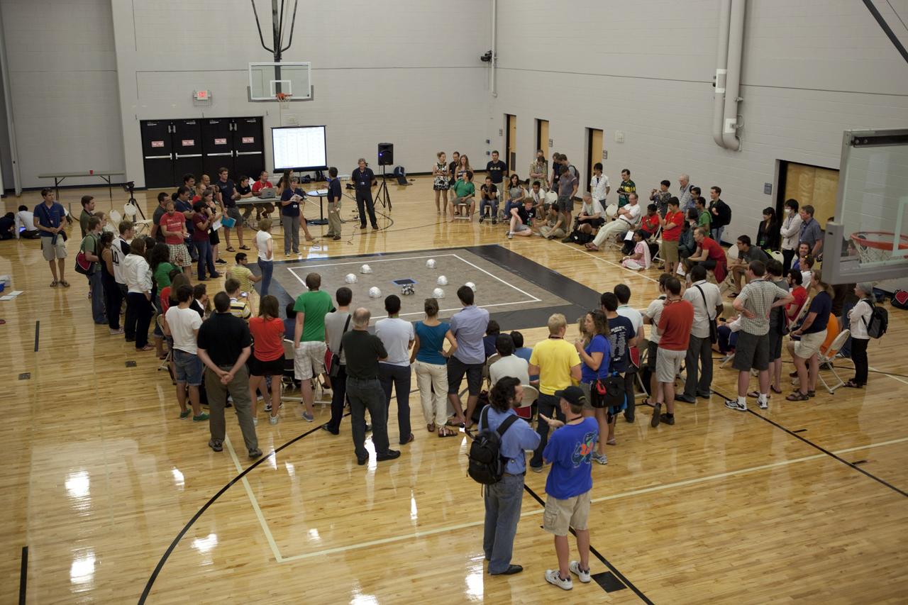 MELBOURNE, Fla. – Students and faculty watch as a robot takes part in a competition during the International Space University's Space Studies Program 2012 session inside a gymnasium at the Florida Institute of Technology in Melbourne, Fla. Photo credit: NASA/Dmitri Gerondidakis