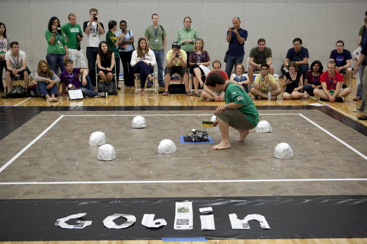 MELBOURNE, Fla. – Students and faculty watch as a robot takes part in a competition during the International Space University's Space Studies Program 2012 session inside a gymnasium at the Florida Institute of Technology in Melbourne, Fla. Photo credit: NASA/Dmitri Gerondidakis