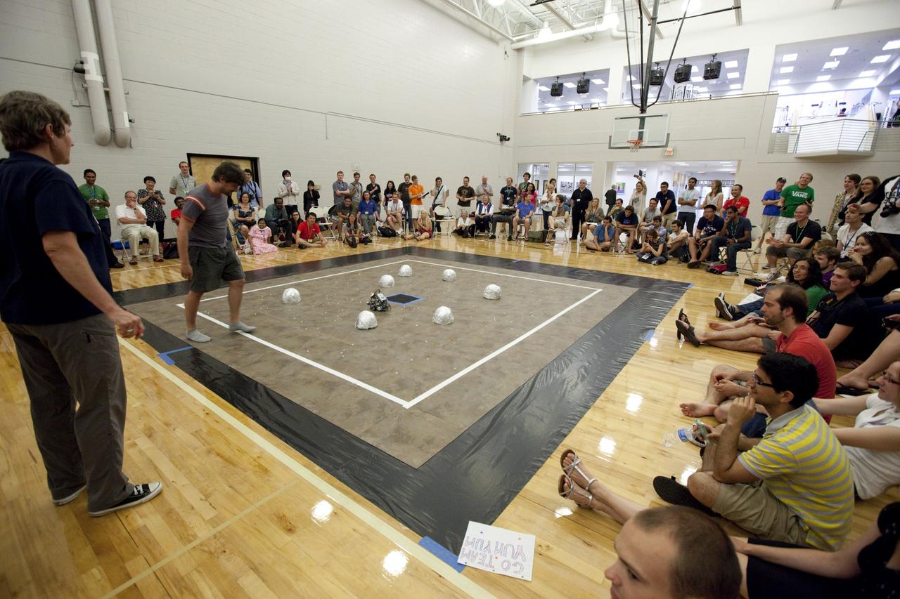 MELBOURNE, Fla. – Students and faculty watch as a robot takes part in a competition during the International Space University's Space Studies Program 2012 session inside a gymnasium at the Florida Institute of Technology in Melbourne, Fla. Photo credit: NASA/Dmitri Gerondidakis