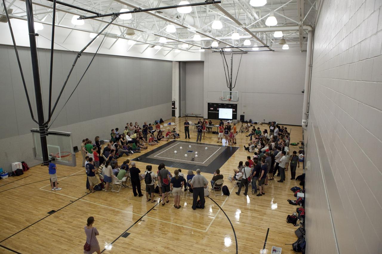 MELBOURNE, Fla. – Students and faculty watch as a robot takes part in a competition during the International Space University's Space Studies Program 2012 session inside a gymnasium at the Florida Institute of Technology in Melbourne, Fla. Photo credit: NASA/Dmitri Gerondidakis