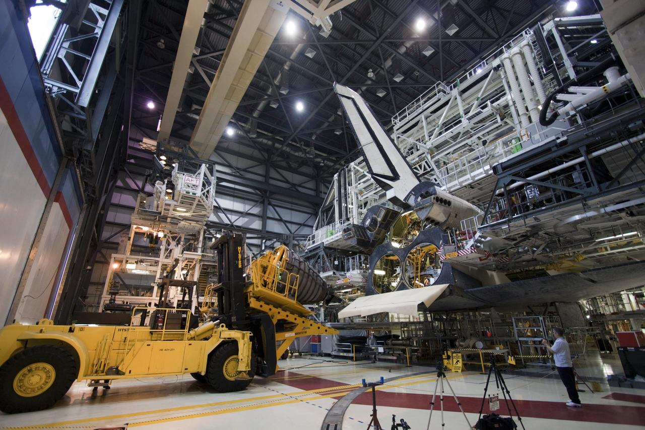 CAPE CANAVERAL, Fla. – In Orbiter Processing Facility-1 at NASA’s Kennedy Space Center in Florida, a technician moves the Hyster forklift carrying replica shuttle main engine RSME number 1 toward space shuttle Atlantis. Three RSMEs will be installed on Atlantis. The work is part of the Space Shuttle Program’s transition and retirement processing of the space shuttle fleet. A groundbreaking was held Jan. 18 for Atlantis’ future home, a 65,000-square-foot exhibit hall in Shuttle Plaza at the Kennedy Space Center Visitor Complex. Atlantis is scheduled to roll over to the visitor complex in November in preparation for the exhibit’s grand opening in July 2013. For more information, visit http://www.nasa.gov/transition. Photo credit: NASA/Jim Grossmann
