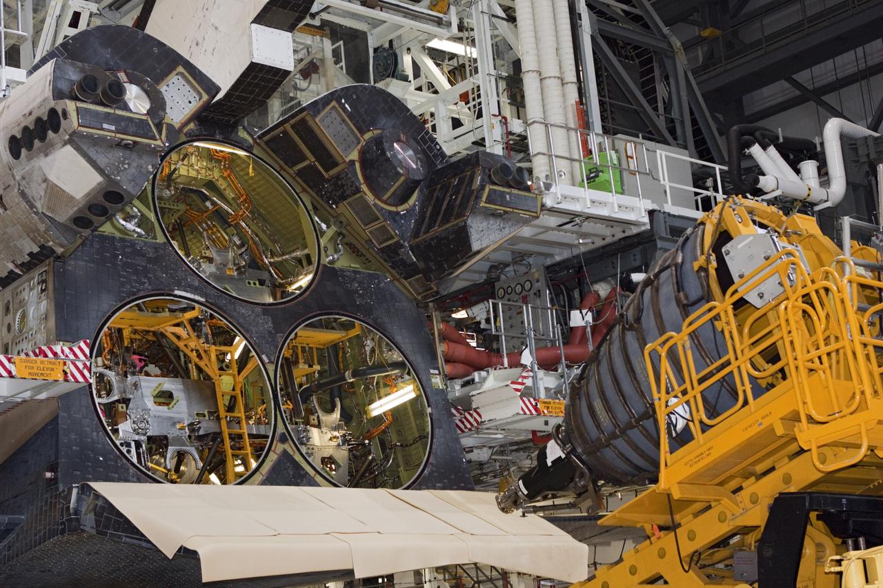 CAPE CANAVERAL, Fla. – In Orbiter Processing Facility-1 at NASA’s Kennedy Space Center in Florida, a technician moves the Hyster forklift carrying replica shuttle main engine RSME number 1 toward space shuttle Atlantis. Three RSMEs will be installed on Atlantis. The work is part of the Space Shuttle Program’s transition and retirement processing of the space shuttle fleet. A groundbreaking was held Jan. 18 for Atlantis’ future home, a 65,000-square-foot exhibit hall in Shuttle Plaza at the Kennedy Space Center Visitor Complex. Atlantis is scheduled to roll over to the visitor complex in November in preparation for the exhibit’s grand opening in July 2013. For more information, visit http://www.nasa.gov/transition. Photo credit: NASA/Jim Grossmann