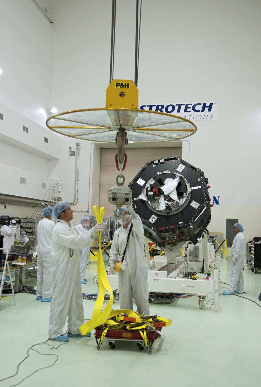 CAPE CANAVERAL, Fla. – Inside the Astrotech payload processing facility near NASA’s Kennedy Space Center in Florida, technicians prepare to perform a magnetic swing test on Radiation Belt Storm Probes, or RBSP, spacecraft A. The magnetic swing test is performed to characterize the magnetic signature of the spacecraft so that when it is taking measurements with its sensors in space scientists can subtract out background noise from the spacecraft itself. NASA’s RBSP mission will help us understand the sun’s influence on Earth and near-Earth space by studying the Earth’s radiation belts on various scales of space and time. RBSP will begin its mission of exploration of Earth’s Van Allen radiation belts and the extremes of space weather after its launch aboard a United Launch Alliance Atlas V rocket. Launch is targeted for Aug. 23. For more information, visit http://www.nasa.gov/rbsp. Photo credit: NASA/Charisse Nahser