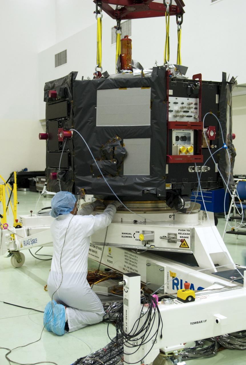 CAPE CANAVERAL, Fla. – Inside the Astrotech payload processing facility near NASA’s Kennedy Space Center in Florida, technicians prepare to perform a magnetic swing test on Radiation Belt Storm Probes, or RBSP, spacecraft A. The magnetic swing test is performed to characterize the magnetic signature of the spacecraft so that when it is taking measurements with its sensors in space scientists can subtract out background noise from the spacecraft itself. NASA’s RBSP mission will help us understand the sun’s influence on Earth and near-Earth space by studying the Earth’s radiation belts on various scales of space and time. RBSP will begin its mission of exploration of Earth’s Van Allen radiation belts and the extremes of space weather after its launch aboard a United Launch Alliance Atlas V rocket. Launch is targeted for Aug. 23. For more information, visit http://www.nasa.gov/rbsp. Photo credit: NASA/Charisse Nahser