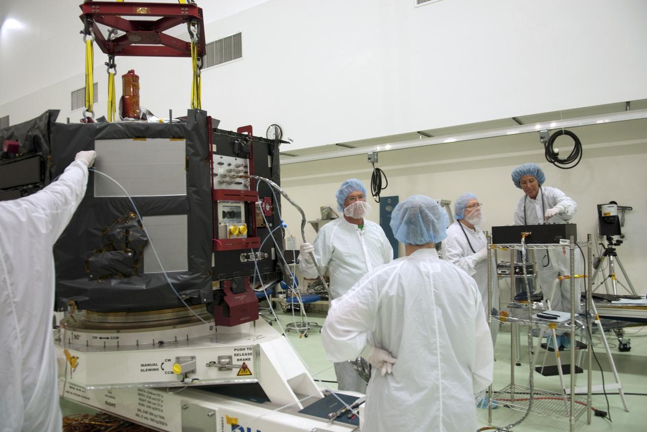 CAPE CANAVERAL, Fla. – Inside the Astrotech payload processing facility near NASA’s Kennedy Space Center in Florida, technicians prepare to perform a magnetic swing test on Radiation Belt Storm Probes, or RBSP, spacecraft A. The magnetic swing test is performed to characterize the magnetic signature of the spacecraft so that when it is taking measurements with its sensors in space scientists can subtract out background noise from the spacecraft itself. NASA’s RBSP mission will help us understand the sun’s influence on Earth and near-Earth space by studying the Earth’s radiation belts on various scales of space and time. RBSP will begin its mission of exploration of Earth’s Van Allen radiation belts and the extremes of space weather after its launch aboard a United Launch Alliance Atlas V rocket. Launch is targeted for Aug. 23. For more information, visit http://www.nasa.gov/rbsp. Photo credit: NASA/Charisse Nahser