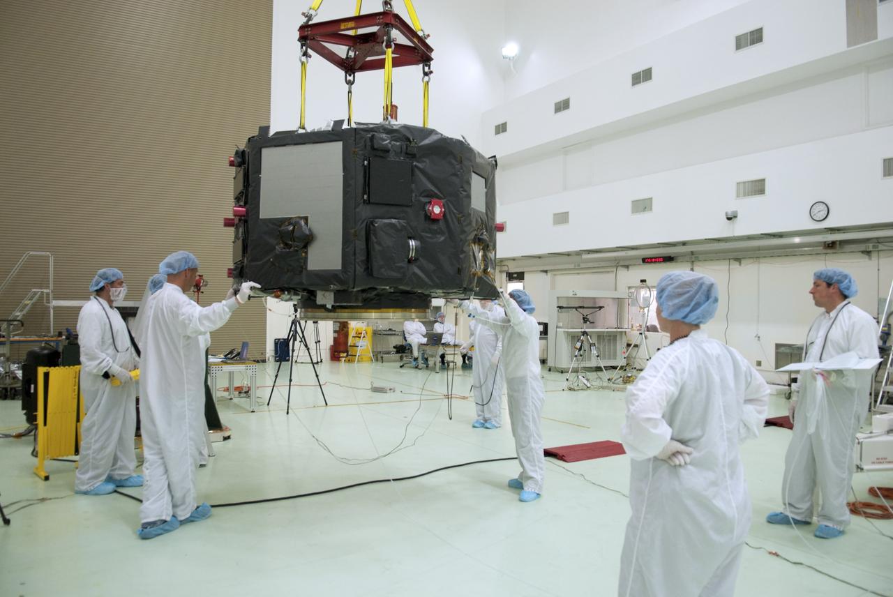 CAPE CANAVERAL, Fla. – Inside the Astrotech payload processing facility near NASA’s Kennedy Space Center in Florida, technicians prepare to perform a magnetic swing test on Radiation Belt Storm Probes, or RBSP, spacecraft A. The magnetic swing test is performed to characterize the magnetic signature of the spacecraft so that when it is taking measurements with its sensors in space scientists can subtract out background noise from the spacecraft itself. NASA’s RBSP mission will help us understand the sun’s influence on Earth and near-Earth space by studying the Earth’s radiation belts on various scales of space and time. RBSP will begin its mission of exploration of Earth’s Van Allen radiation belts and the extremes of space weather after its launch aboard a United Launch Alliance Atlas V rocket. Launch is targeted for Aug. 23. For more information, visit http://www.nasa.gov/rbsp. Photo credit: NASA/Charisse Nahser