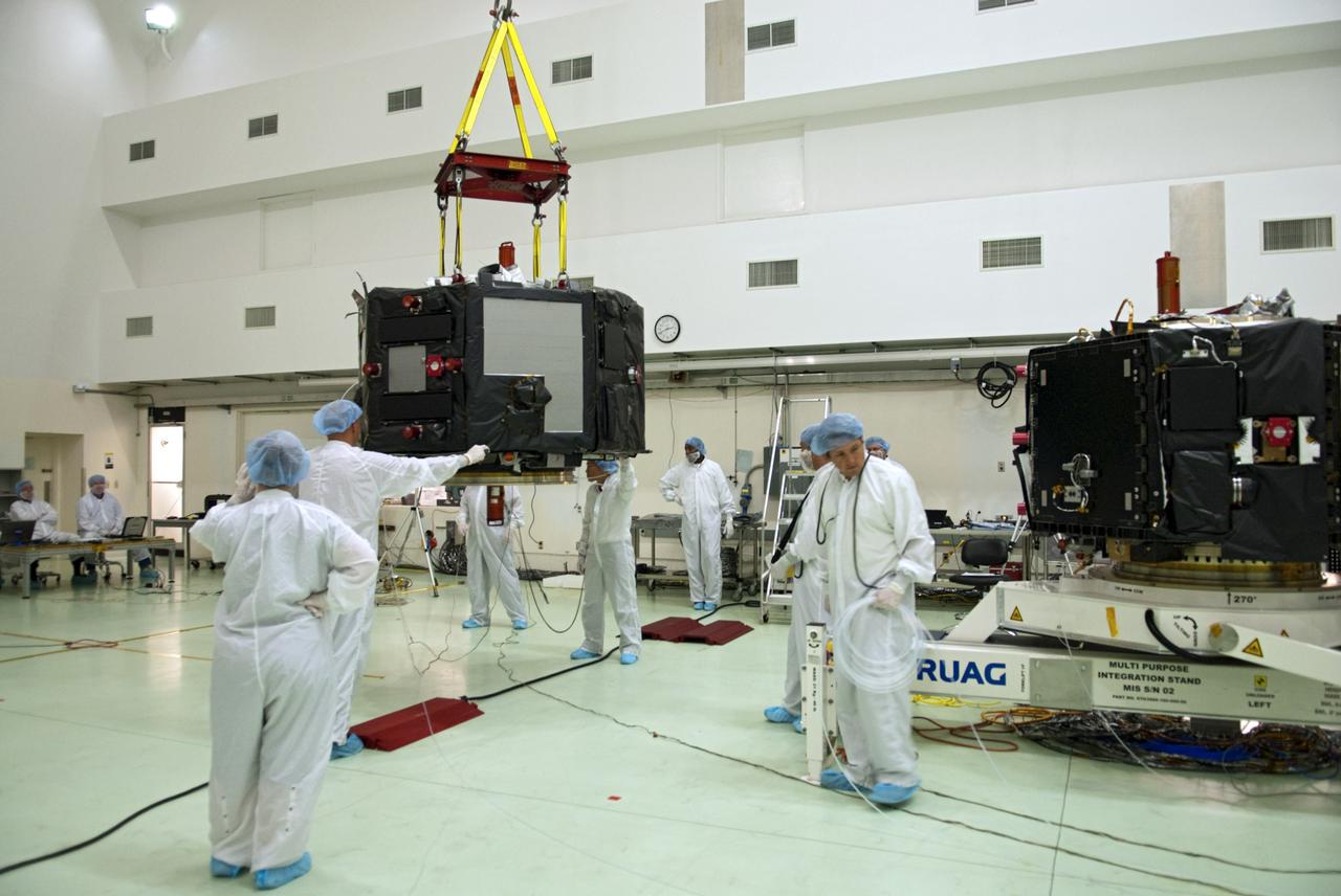 CAPE CANAVERAL, Fla. – Inside the Astrotech payload processing facility near NASA’s Kennedy Space Center in Florida, technicians prepare to perform a magnetic swing test on Radiation Belt Storm Probes, or RBSP, spacecraft A. The magnetic swing test is performed to characterize the magnetic signature of the spacecraft so that when it is taking measurements with its sensors in space scientists can subtract out background noise from the spacecraft itself. NASA’s RBSP mission will help us understand the sun’s influence on Earth and near-Earth space by studying the Earth’s radiation belts on various scales of space and time. RBSP will begin its mission of exploration of Earth’s Van Allen radiation belts and the extremes of space weather after its launch aboard a United Launch Alliance Atlas V rocket. Launch is targeted for Aug. 23. For more information, visit http://www.nasa.gov/rbsp. Photo credit: NASA/Charisse Nahser