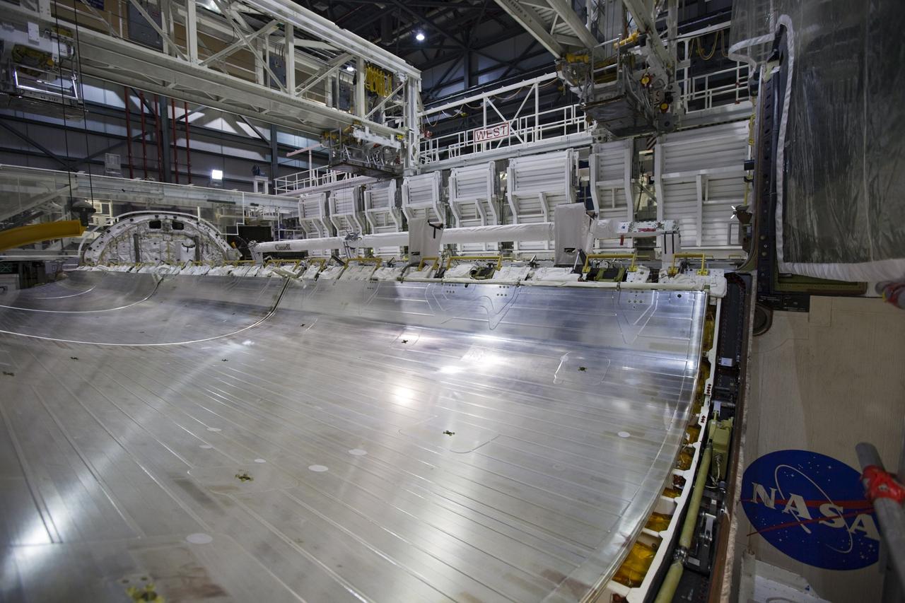 CAPE CANAVERAL, Fla. – Inside Orbiter Processing Facility-1 at NASA’s Kennedy Space Center in Florida, preparations are underway to begin closing the payload bay doors on space shuttle Atlantis in preparation for its move to the Vehicle Assembly Building.    The work is part of the Space Shuttle Program’s transition and retirement processing of the space shuttle fleet. A groundbreaking was held Jan. 18 for Atlantis’ future home, a 65,000-square-foot exhibit hall in Shuttle Plaza at the Kennedy Space Center Visitor Complex. Atlantis is scheduled to roll over to the visitor complex in November in preparation for the exhibit’s grand opening in July 2013. For more information, visit http://www.nasa.gov/shuttle.  Photo credit: NASA/Dimitri Gerondidakis