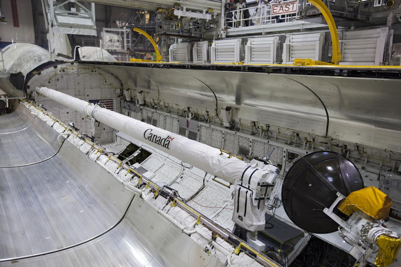 CAPE CANAVERAL, Fla. – Inside Orbiter Processing Facility-1 at NASA’s Kennedy Space Center in Florida, one of the two payload bay doors on space shuttle Atlantis is closed in preparation for its move to the Vehicle Assembly Building. The work is part of the Space Shuttle Program’s transition and retirement processing of the space shuttle fleet. A groundbreaking was held Jan. 18 for Atlantis’ future home, a 65,000-square-foot exhibit hall in Shuttle Plaza at the Kennedy Space Center Visitor Complex. Atlantis is scheduled to roll over to the visitor complex in November in preparation for the exhibit’s grand opening in July 2013. For more information, visit http://www.nasa.gov/shuttle. Photo credit: NASA/Dimitri Gerondidakis