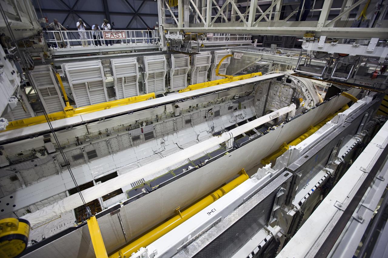 CAPE CANAVERAL, Fla. – Inside Orbiter Processing Facility-1 at NASA’s Kennedy Space Center in Florida, United Space Alliance technicians monitor the progress of space shuttle Atlantis’ payload bay doors as they are closed in preparation for its move to the Vehicle Assembly Building. The work is part of the Space Shuttle Program’s transition and retirement processing of the space shuttle fleet. A groundbreaking was held Jan. 18 for Atlantis’ future home, a 65,000-square-foot exhibit hall in Shuttle Plaza at the Kennedy Space Center Visitor Complex. Atlantis is scheduled to roll over to the visitor complex in November in preparation for the exhibit’s grand opening in July 2013. For more information, visit http://www.nasa.gov/shuttle. Photo credit: NASA/Dimitri Gerondidakis