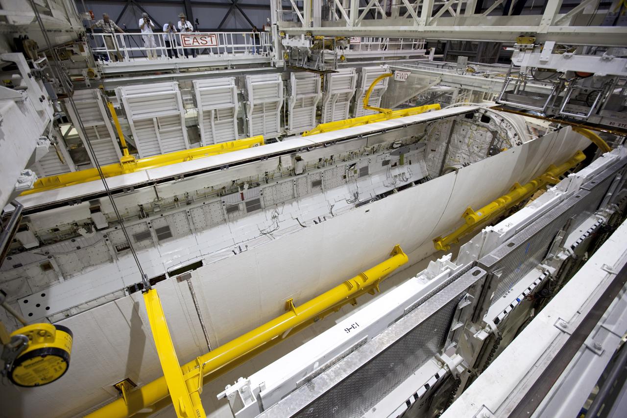 CAPE CANAVERAL, Fla. – Inside Orbiter Processing Facility-1 at NASA’s Kennedy Space Center in Florida, United Space Alliance technicians monitor the progress of space shuttle Atlantis’ payload bay doors as they are closed in preparation for its move to the Vehicle Assembly Building. The work is part of the Space Shuttle Program’s transition and retirement processing of the space shuttle fleet. A groundbreaking was held Jan. 18 for Atlantis’ future home, a 65,000-square-foot exhibit hall in Shuttle Plaza at the Kennedy Space Center Visitor Complex. Atlantis is scheduled to roll over to the visitor complex in November in preparation for the exhibit’s grand opening in July 2013. For more information, visit http://www.nasa.gov/shuttle. Photo credit: NASA/Dimitri Gerondidakis