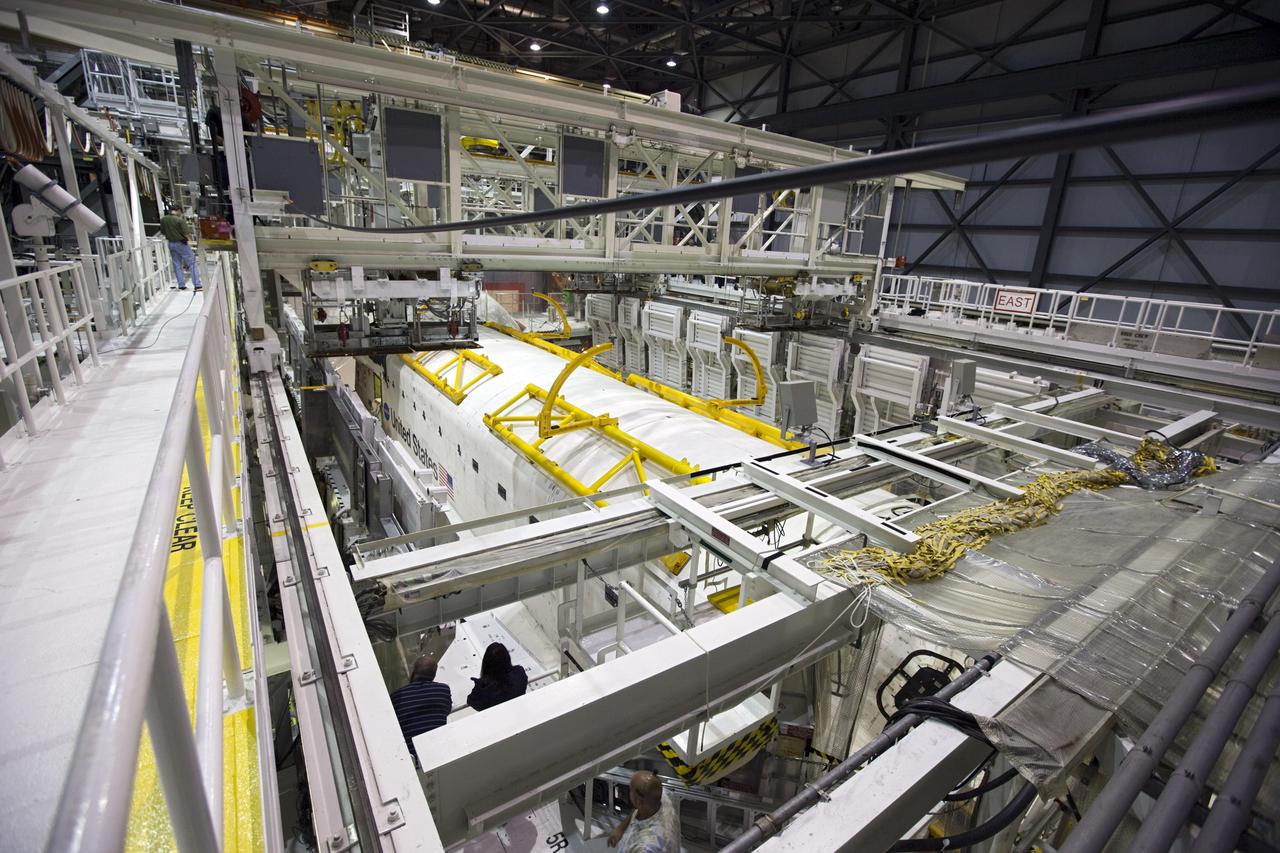 CAPE CANAVERAL, Fla. – Inside Orbiter Processing Facility-1 at NASA’s Kennedy Space Center in Florida, space shuttle Atlantis’ payload bay doors were closed in preparation for its move to the Vehicle Assembly Building. The work is part of the Space Shuttle Program’s transition and retirement processing of the space shuttle fleet. A groundbreaking was held Jan. 18 for Atlantis’ future home, a 65,000-square-foot exhibit hall in Shuttle Plaza at the Kennedy Space Center Visitor Complex. Atlantis is scheduled to roll over to the visitor complex in November in preparation for the exhibit’s grand opening in July 2013. For more information, visit http://www.nasa.gov/shuttle. Photo credit: NASA/Dimitri Gerondidakis