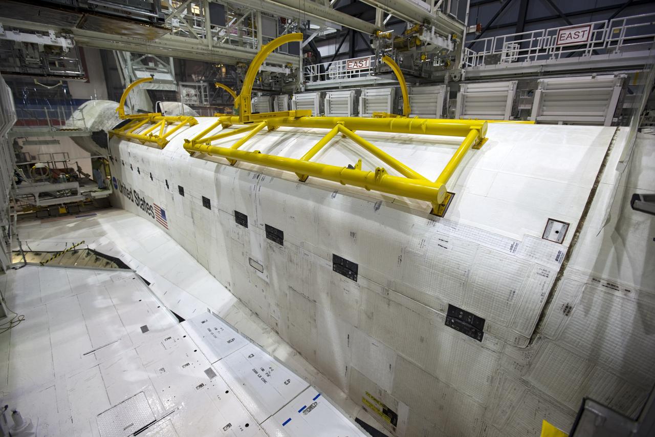CAPE CANAVERAL, Fla. – Inside Orbiter Processing Facility-1 at NASA’s Kennedy Space Center in Florida, space shuttle Atlantis’ payload bay doors were closed in preparation for its move to the Vehicle Assembly Building.    The work is part of the Space Shuttle Program’s transition and retirement processing of the space shuttle fleet. A groundbreaking was held Jan. 18 for Atlantis’ future home, a 65,000-square-foot exhibit hall in Shuttle Plaza at the Kennedy Space Center Visitor Complex. Atlantis is scheduled to roll over to the visitor complex in November in preparation for the exhibit’s grand opening in July 2013. For more information, visit http://www.nasa.gov/shuttle.  Photo credit: NASA/Dimitri Gerondidakis