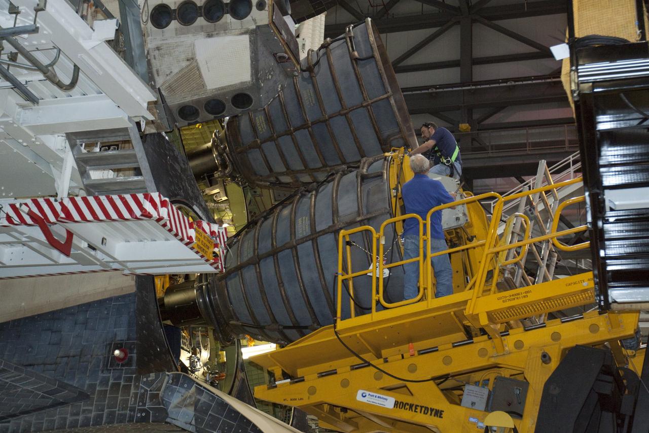 CAPE CANAVERAL, Fla. – In Orbiter Processing Facility-1 at NASA’s Kennedy Space Center in Florida, technicians on the Hyster forklift position replica shuttle main engine RSME number 2 for installation on space shuttle Atlantis. Three RSMEs will be installed on Atlantis. The work is part of the Space Shuttle Program’s transition and retirement processing of the space shuttle fleet. A groundbreaking was held Jan. 18 for Atlantis’ future home, a 65,000-square-foot exhibit hall in Shuttle Plaza at the Kennedy Space Center Visitor Complex. Atlantis is scheduled to roll over to the visitor complex in November in preparation for the exhibit’s grand opening in July 2013. For more information, visit http://www.nasa.gov/transition. Photo credit: NASA/Glenn Benson