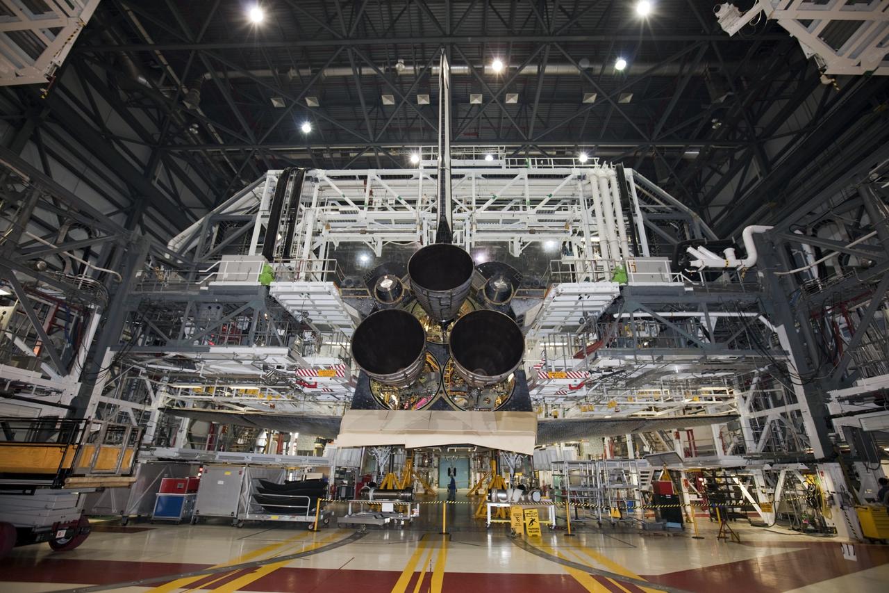 CAPE CANAVERAL, Fla. - In Orbiter Processing Facility Bay 1 at NASA’s Kennedy Space Center in Florida, three replica shuttle main engines RSMEs have been installed on the space shuttle Atlantis. In this wide-angle view, the orbiter is surrounded by work platforms allowing access to all areas of the spacecraft. Three RSMEs were installed on Atlantis. The replicas were built in the Pratt & Whitney Rocketdyne engine shop at KSC to replace the space shuttle main engines SSMEs which will be placed in storage to support NASA's Space Launch System currently under development. The RSME installation is part of the Space Shuttle Program’s transition and retirement processing of the space shuttle fleet. A groundbreaking was held Jan. 18, 2012 for Atlantis’ future home, a 65,000-square-foot exhibit hall in Shuttle Plaza at the Kennedy Space Center Visitor Complex. Atlantis is scheduled to roll over to the visitor complex during November in preparation for the exhibit’s grand opening in July 2013. For more information, visit http://www.nasa.gov/transition. Photo credit: NASA/Glenn Benson