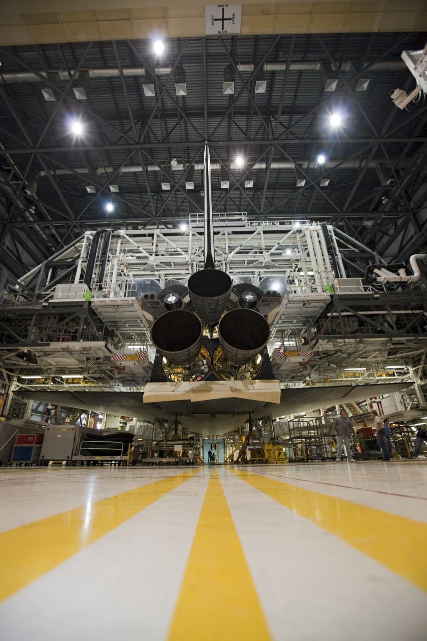 CAPE CANAVERAL, Fla. - In Orbiter Processing Facility Bay 1 at NASA’s Kennedy Space Center in Florida, three replica shuttle main engines RSMEs have been installed on the space shuttle Atlantis. In this wide-angle floor view, the orbiter is surrounded by work platforms allowing access to all areas of the spacecraft. Three RSMEs were installed on Atlantis. The replicas were built in the Pratt & Whitney Rocketdyne engine shop at KSC to replace the space shuttle main engines SSMEs which will be placed in storage to support NASA's Space Launch System currently under development. The RSME installation is part of the Space Shuttle Program’s transition and retirement processing of the space shuttle fleet. A groundbreaking was held Jan. 18, 2012 for Atlantis’ future home, a 65,000-square-foot exhibit hall in Shuttle Plaza at the Kennedy Space Center Visitor Complex. Atlantis is scheduled to roll over to the visitor complex during November in preparation for the exhibit’s grand opening in July 2013. For more information, visit http://www.nasa.gov/transition. Photo credit: NASA/Glenn Benson