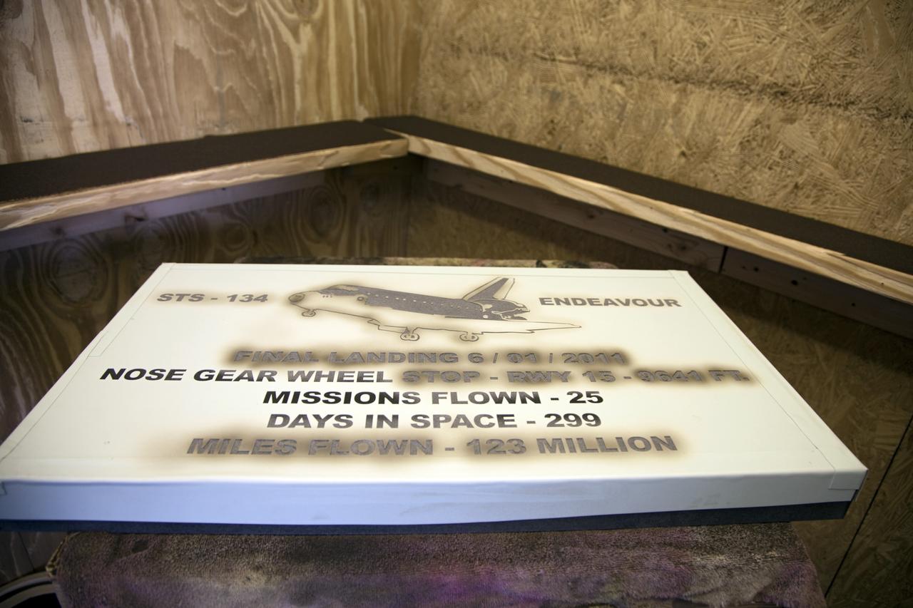 CAPE CANAVERAL, Fla. – At C Spray Glass Blasting of Cocoa Beach, Fla., a worker completes the commemorative plaque to mark space shuttle Endeavour’s wheel stop location. The special plaque will be permanently mounted at the Shuttle Landing Facility, or SLF, runway edge at NASA’s Kennedy Space Center in Florida to commemorate Endeavour’s final space shuttle landing. Endeavour completed the STS-134 mission by landing at the SLF on June 1, 2011, at 2:35 a.m. EDT. Endeavour flew 25 missions, completed 4,671 orbits of the Earth, traveled more than 122 million miles and spent 299 days in space. Endeavour carried 173 astronauts to space. Photo credit: NASA/Lorne Mathre