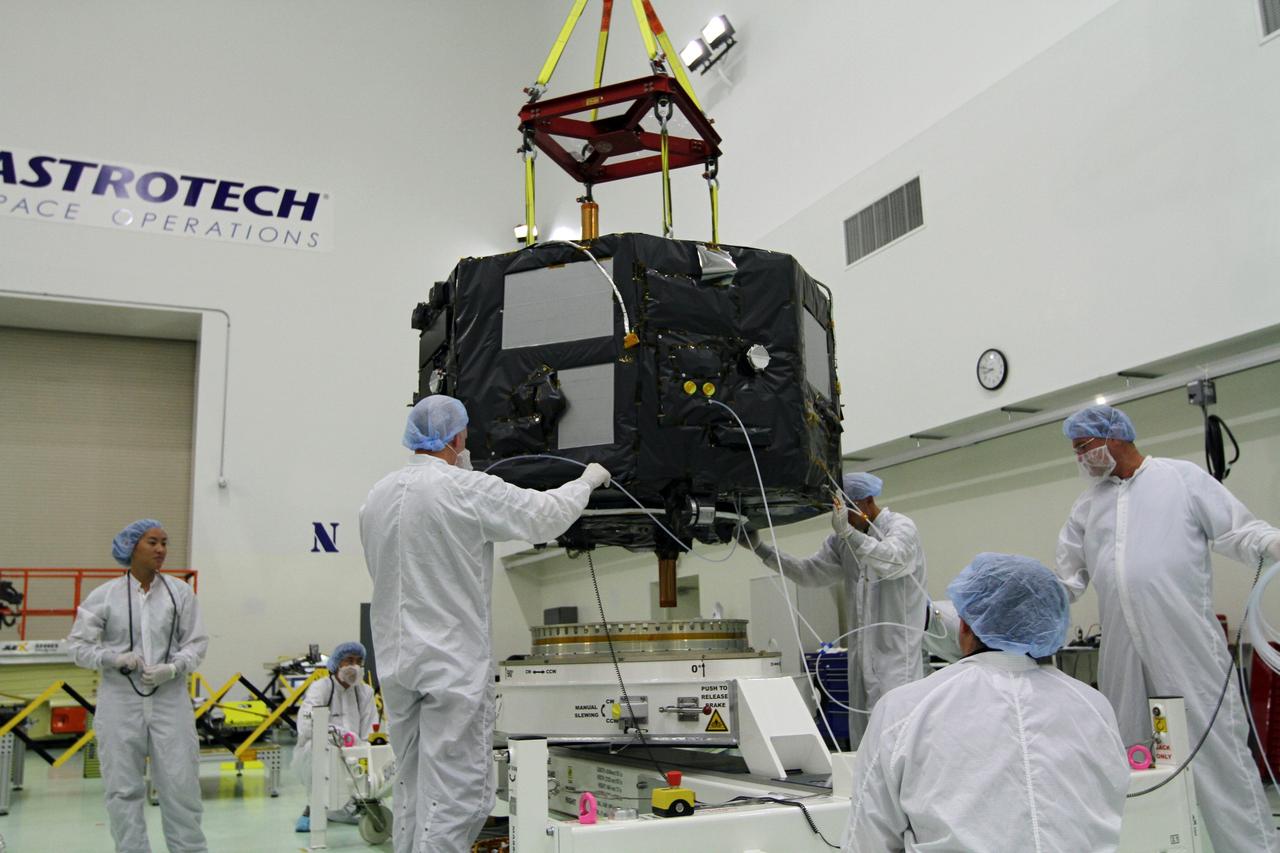 CAPE CANAVERAL, Fla. - Inside the Astrotech payload processing facility near NASA’s Kennedy Space Center in Florida, technicians prepare Radiation Belt Storm Probes, or RBSP, spacecraft A for a spin test. During the spin test, the spacecraft is turned at a rate of 55 rpm to ensure that it is properly balanced.    NASA’s RBSP mission will help us understand the sun’s influence on Earth and near-Earth space by studying the Earth’s radiation belts on various scales of space and time. RBSP will begin its mission of exploration of Earth’s Van Allen radiation belts and the extremes of space weather after its launch aboard a United Launch Alliance Atlas V rocket. Launch is targeted for Aug. 23. For more information, visit http://www.nasa.gov/rbsp. Photo credit: NASA/Charisse Nahser