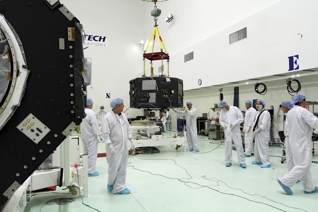 CAPE CANAVERAL, Fla. - Inside the Astrotech payload processing facility near NASA’s Kennedy Space Center in Florida, technicians prepare Radiation Belt Storm Probes, or RBSP, spacecraft A for a spin test. During the spin test, the spacecraft is turned at a rate of 55 rpm to ensure that it is properly balanced.    NASA’s RBSP mission will help us understand the sun’s influence on Earth and near-Earth space by studying the Earth’s radiation belts on various scales of space and time. RBSP will begin its mission of exploration of Earth’s Van Allen radiation belts and the extremes of space weather after its launch aboard a United Launch Alliance Atlas V rocket. Launch is targeted for Aug. 23. For more information, visit http://www.nasa.gov/rbsp. Photo credit: NASA/Charisse Nahser
