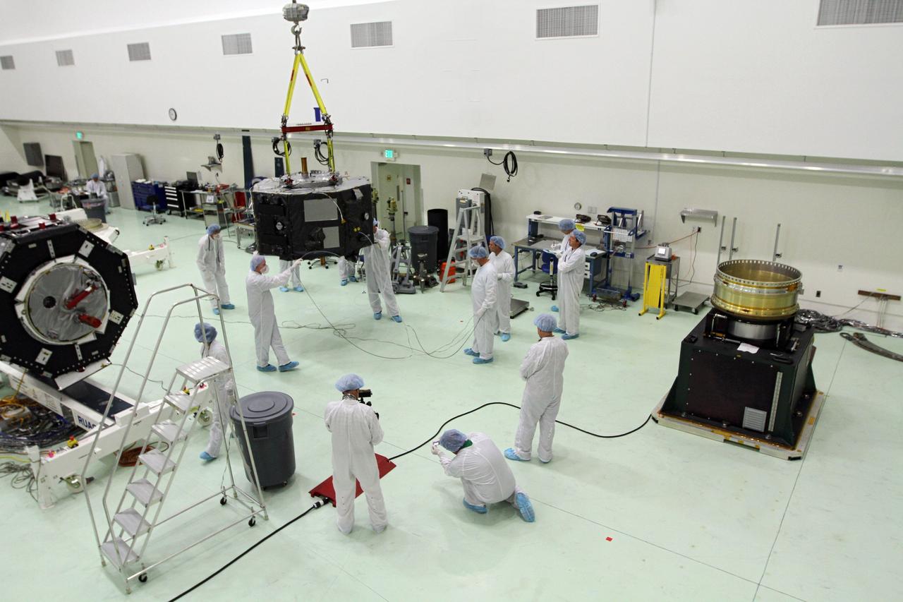 CAPE CANAVERAL, Fla. - Inside the Astrotech payload processing facility near NASA’s Kennedy Space Center in Florida, technicians prepare Radiation Belt Storm Probes, or RBSP, spacecraft A for a spin test. During the spin test, the spacecraft is turned at a rate of 55 rpm to ensure that it is properly balanced.    NASA’s RBSP mission will help us understand the sun’s influence on Earth and near-Earth space by studying the Earth’s radiation belts on various scales of space and time. RBSP will begin its mission of exploration of Earth’s Van Allen radiation belts and the extremes of space weather after its launch aboard a United Launch Alliance Atlas V rocket. Launch is targeted for Aug. 23. For more information, visit http://www.nasa.gov/rbsp. Photo credit: NASA/Charisse Nahser