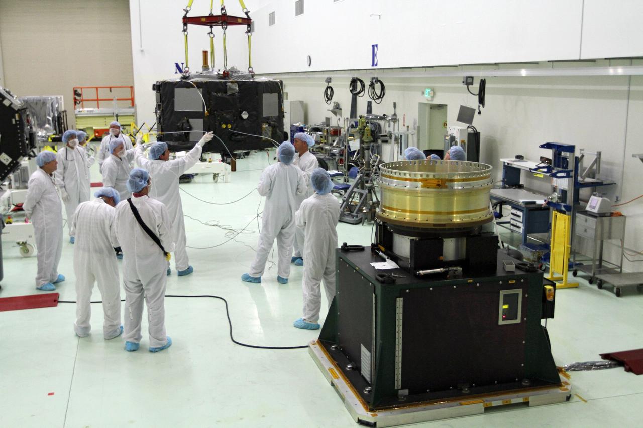 CAPE CANAVERAL, Fla. - Inside the Astrotech payload processing facility near NASA’s Kennedy Space Center in Florida, technicians prepare Radiation Belt Storm Probes, or RBSP, spacecraft A for a spin test. During the spin test, the spacecraft is turned at a rate of 55 rpm to ensure that it is properly balanced.    NASA’s RBSP mission will help us understand the sun’s influence on Earth and near-Earth space by studying the Earth’s radiation belts on various scales of space and time. RBSP will begin its mission of exploration of Earth’s Van Allen radiation belts and the extremes of space weather after its launch aboard a United Launch Alliance Atlas V rocket. Launch is targeted for Aug. 23. For more information, visit http://www.nasa.gov/rbsp. Photo credit: NASA/Charisse Nahser