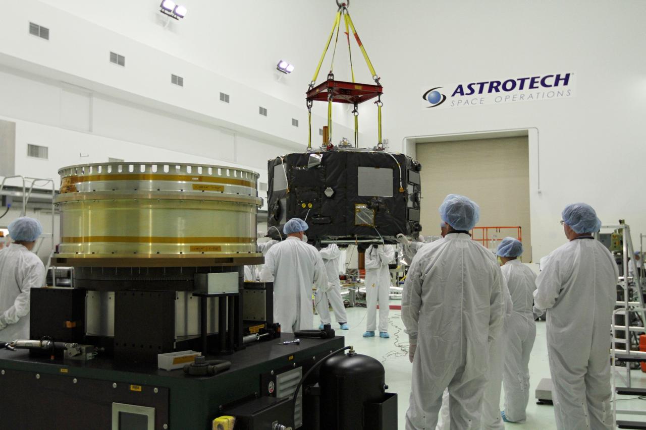 CAPE CANAVERAL, Fla. - Inside the Astrotech payload processing facility near NASA’s Kennedy Space Center in Florida, technicians prepare Radiation Belt Storm Probes, or RBSP, spacecraft A for a spin test. During the spin test, the spacecraft is turned at a rate of 55 rpm to ensure that it is properly balanced.    NASA’s RBSP mission will help us understand the sun’s influence on Earth and near-Earth space by studying the Earth’s radiation belts on various scales of space and time. RBSP will begin its mission of exploration of Earth’s Van Allen radiation belts and the extremes of space weather after its launch aboard a United Launch Alliance Atlas V rocket. Launch is targeted for Aug. 23. For more information, visit http://www.nasa.gov/rbsp. Photo credit: NASA/Charisse Nahser
