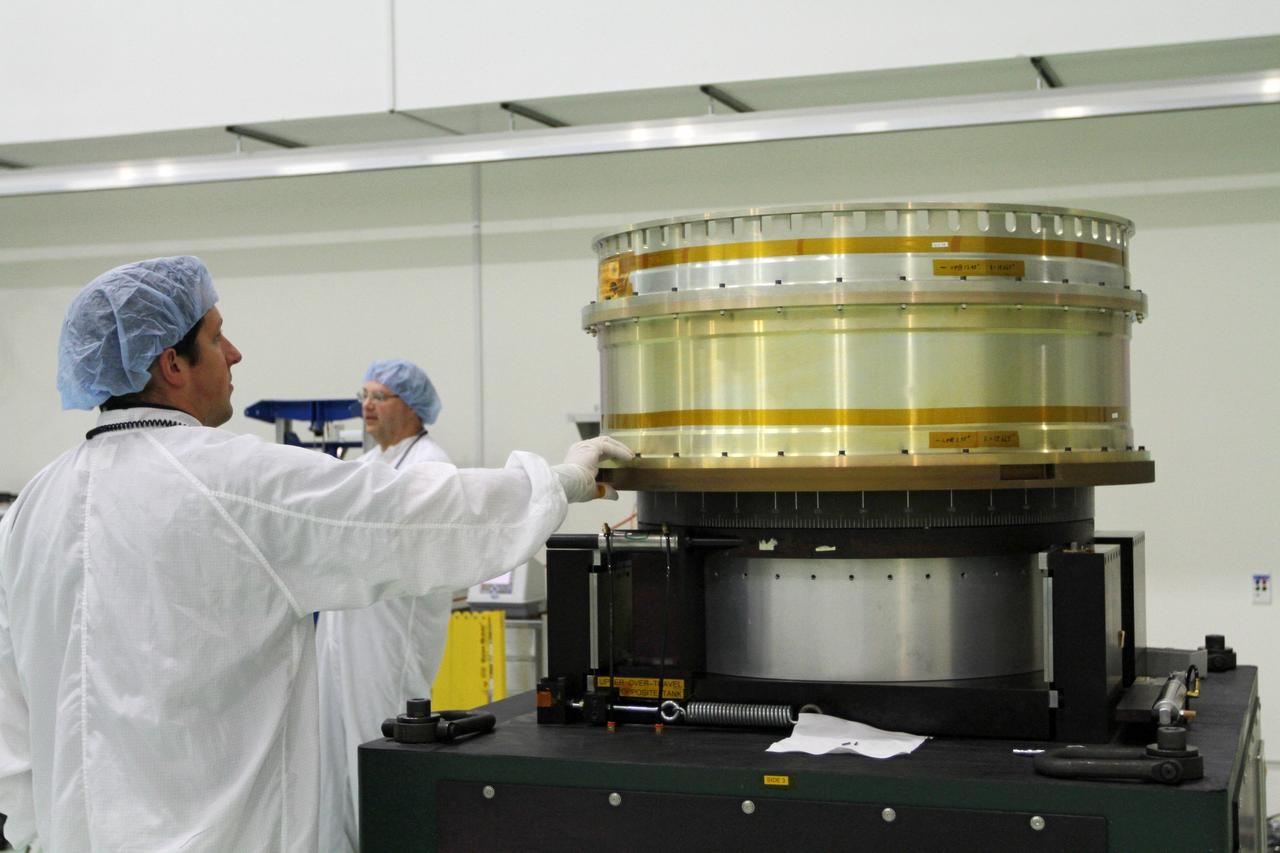 CAPE CANAVERAL, Fla. - Inside the Astrotech payload processing facility near NASA’s Kennedy Space Center in Florida, technicians prepare the test stand for Radiation Belt Storm Probes, or RBSP, spacecraft A for a spin test. During the spin test, the spacecraft is turned at a rate of 55 rpm to ensure that it is properly balanced.    NASA’s RBSP mission will help us understand the sun’s influence on Earth and near-Earth space by studying the Earth’s radiation belts on various scales of space and time. RBSP will begin its mission of exploration of Earth’s Van Allen radiation belts and the extremes of space weather after its launch aboard a United Launch Alliance Atlas V rocket. Launch is targeted for Aug. 23. For more information, visit http://www.nasa.gov/rbsp. Photo credit: NASA/Charisse Nahser