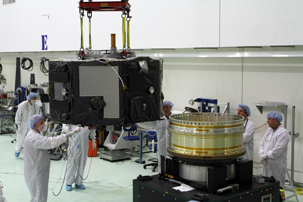 CAPE CANAVERAL, Fla. - Inside the Astrotech payload processing facility near NASA’s Kennedy Space Center in Florida, technicians prepare Radiation Belt Storm Probes, or RBSP, spacecraft A for a spin test. During the spin test, the spacecraft is turned at a rate of 55 rpm to ensure that it is properly balanced.    NASA’s RBSP mission will help us understand the sun’s influence on Earth and near-Earth space by studying the Earth’s radiation belts on various scales of space and time. RBSP will begin its mission of exploration of Earth’s Van Allen radiation belts and the extremes of space weather after its launch aboard a United Launch Alliance Atlas V rocket. Launch is targeted for Aug. 23. For more information, visit http://www.nasa.gov/rbsp. Photo credit: NASA/Charisse Nahser