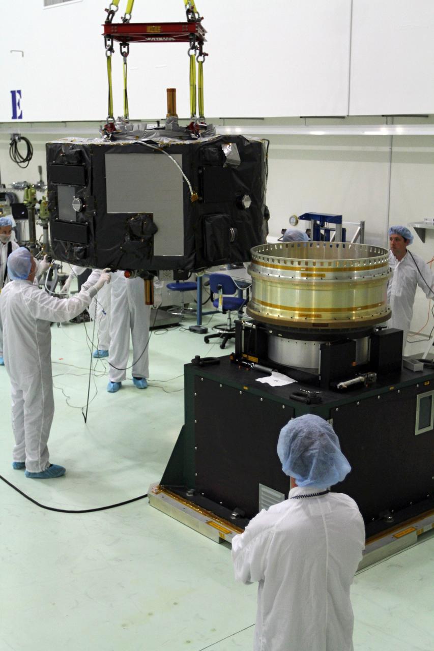 CAPE CANAVERAL, Fla. - Inside the Astrotech payload processing facility near NASA’s Kennedy Space Center in Florida, technicians prepare Radiation Belt Storm Probes, or RBSP, spacecraft A for a spin test. During the spin test, the spacecraft is turned at a rate of 55 rpm to ensure that it is properly balanced.    NASA’s RBSP mission will help us understand the sun’s influence on Earth and near-Earth space by studying the Earth’s radiation belts on various scales of space and time. RBSP will begin its mission of exploration of Earth’s Van Allen radiation belts and the extremes of space weather after its launch aboard a United Launch Alliance Atlas V rocket. Launch is targeted for Aug. 23. For more information, visit http://www.nasa.gov/rbsp. Photo credit: NASA/Charisse Nahser