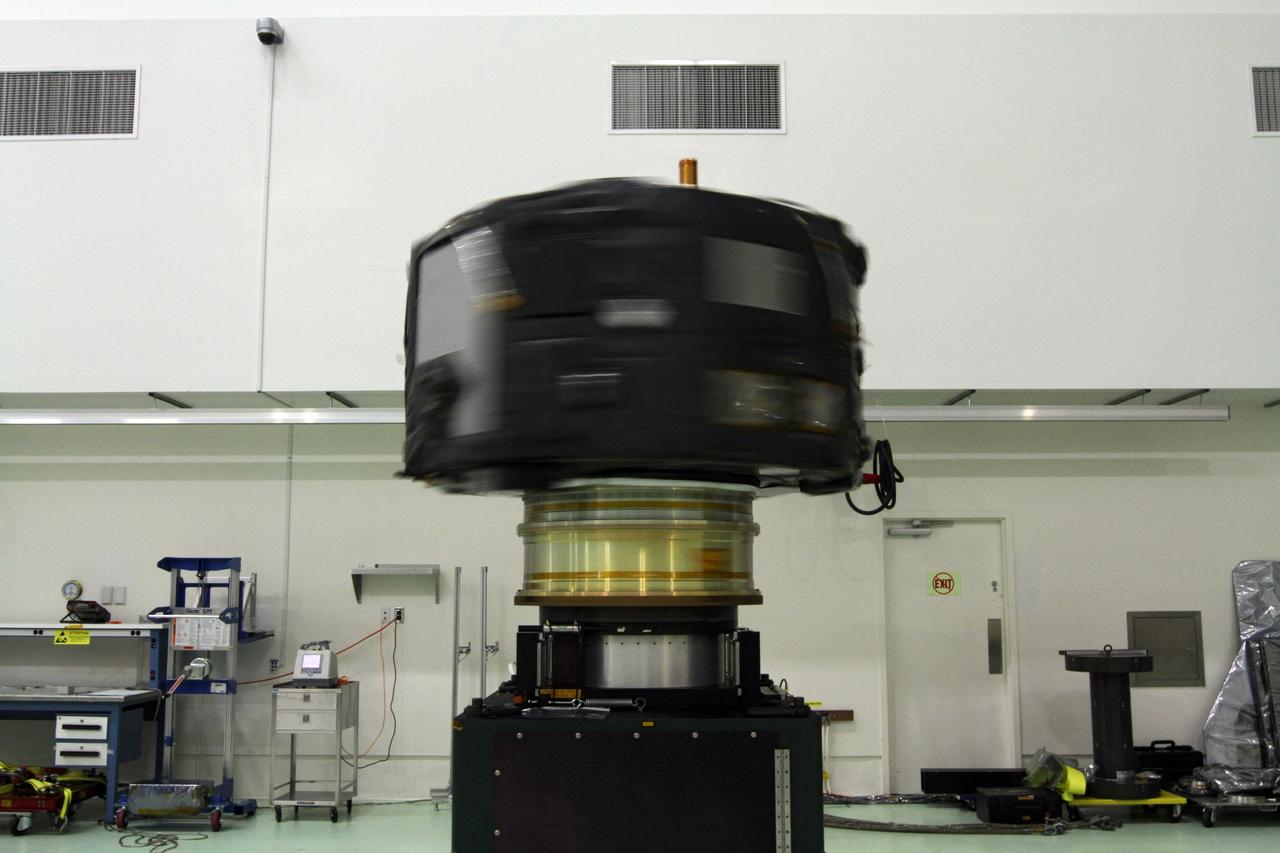 CAPE CANAVERAL, Fla. - Inside the Astrotech payload processing facility near NASA’s Kennedy Space Center in Florida, the Radiation Belt Storm Probes, or RBSP, spacecraft A is undergoing a spin test. During the spin test, the spacecraft is turned at a rate of 55 rpm to ensure that it is properly balanced.    NASA’s RBSP mission will help us understand the sun’s influence on Earth and near-Earth space by studying the Earth’s radiation belts on various scales of space and time. RBSP will begin its mission of exploration of Earth’s Van Allen radiation belts and the extremes of space weather after its launch aboard a United Launch Alliance Atlas V rocket. Launch is targeted for Aug. 23. For more information, visit http://www.nasa.gov/rbsp. Photo credit: NASA/Charisse Nahser