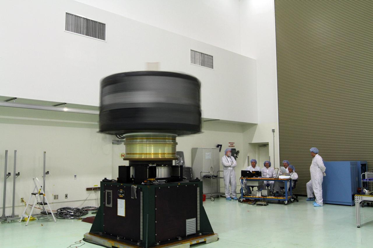 CAPE CANAVERAL, Fla. - Inside the Astrotech payload processing facility near NASA’s Kennedy Space Center in Florida, technicians monitor the progress as the Radiation Belt Storm Probes, or RBSP, spacecraft A undergoes a spin test. During the spin test, the spacecraft is turned at a rate of 55 rpm to ensure that it is properly balanced.    NASA’s RBSP mission will help us understand the sun’s influence on Earth and near-Earth space by studying the Earth’s radiation belts on various scales of space and time. RBSP will begin its mission of exploration of Earth’s Van Allen radiation belts and the extremes of space weather after its launch aboard a United Launch Alliance Atlas V rocket. Launch is targeted for Aug. 23. For more information, visit http://www.nasa.gov/rbsp. Photo credit: NASA/Charisse Nahser