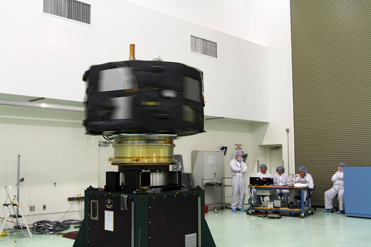 CAPE CANAVERAL, Fla. - Inside the Astrotech payload processing facility near NASA’s Kennedy Space Center in Florida, technicians monitor the progress as the Radiation Belt Storm Probes, or RBSP, spacecraft A undergoes a spin test. During the spin test, the spacecraft is turned at a rate of 55 rpm to ensure that it is properly balanced.    NASA’s RBSP mission will help us understand the sun’s influence on Earth and near-Earth space by studying the Earth’s radiation belts on various scales of space and time. RBSP will begin its mission of exploration of Earth’s Van Allen radiation belts and the extremes of space weather after its launch aboard a United Launch Alliance Atlas V rocket. Launch is targeted for Aug. 23. For more information, visit http://www.nasa.gov/rbsp. Photo credit: NASA/Charisse Nahser