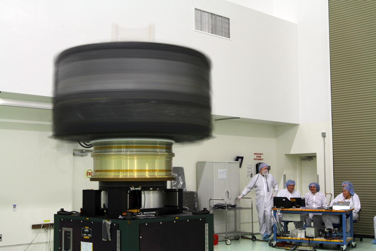 CAPE CANAVERAL, Fla. - Inside the Astrotech payload processing facility near NASA’s Kennedy Space Center in Florida, technicians monitor the progress as the Radiation Belt Storm Probes, or RBSP, spacecraft A undergoes a spin test. During the spin test, the spacecraft is turned at a rate of 55 rpm to ensure that it is properly balanced.    NASA’s RBSP mission will help us understand the sun’s influence on Earth and near-Earth space by studying the Earth’s radiation belts on various scales of space and time. RBSP will begin its mission of exploration of Earth’s Van Allen radiation belts and the extremes of space weather after its launch aboard a United Launch Alliance Atlas V rocket. Launch is targeted for Aug. 23. For more information, visit http://www.nasa.gov/rbsp. Photo credit: NASA/Charisse Nahser