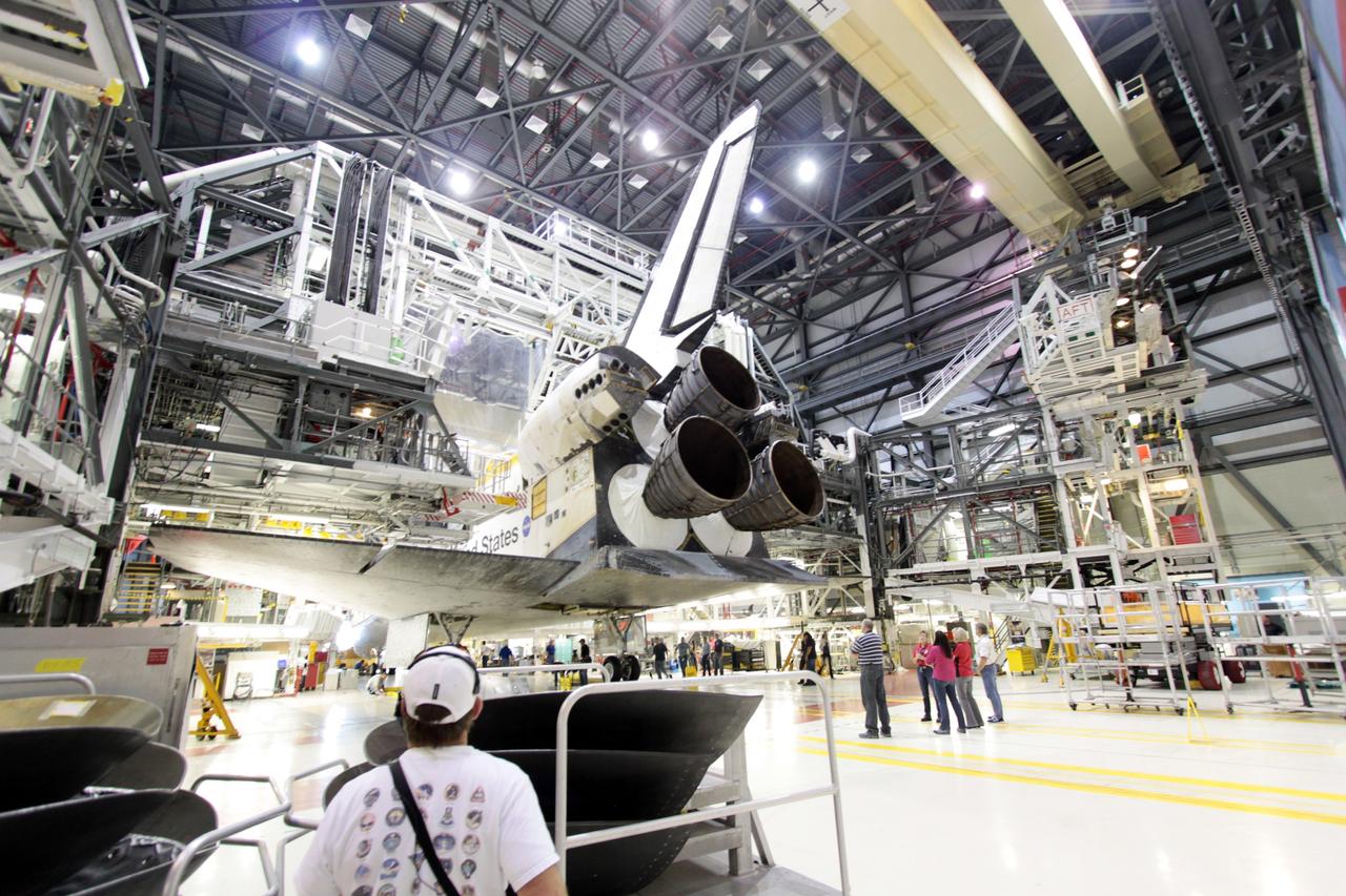 CAPE CANAVERAL, Fla. - Observers watch as preparations begin to move space shuttle Atlantis out of Orbiter Processing Facility-1 and into High Bay 4 of the nearby Vehicle Assembly Building at NASA's Kennedy Space Center in Florida.     The work is part of the Space Shuttle Program's transition and retirement processing of the space shuttle fleet. A groundbreaking was held Jan. 18 for Atlantis' future home, a 65,000-square-foot exhibit hall in Shuttle Plaza at the Kennedy Space Center Visitor Complex. Atlantis is scheduled to roll over to the visitor complex in November in preparation for the exhibit's grand opening in July 2013. Photo credit: NASA/Jim Grossmann
