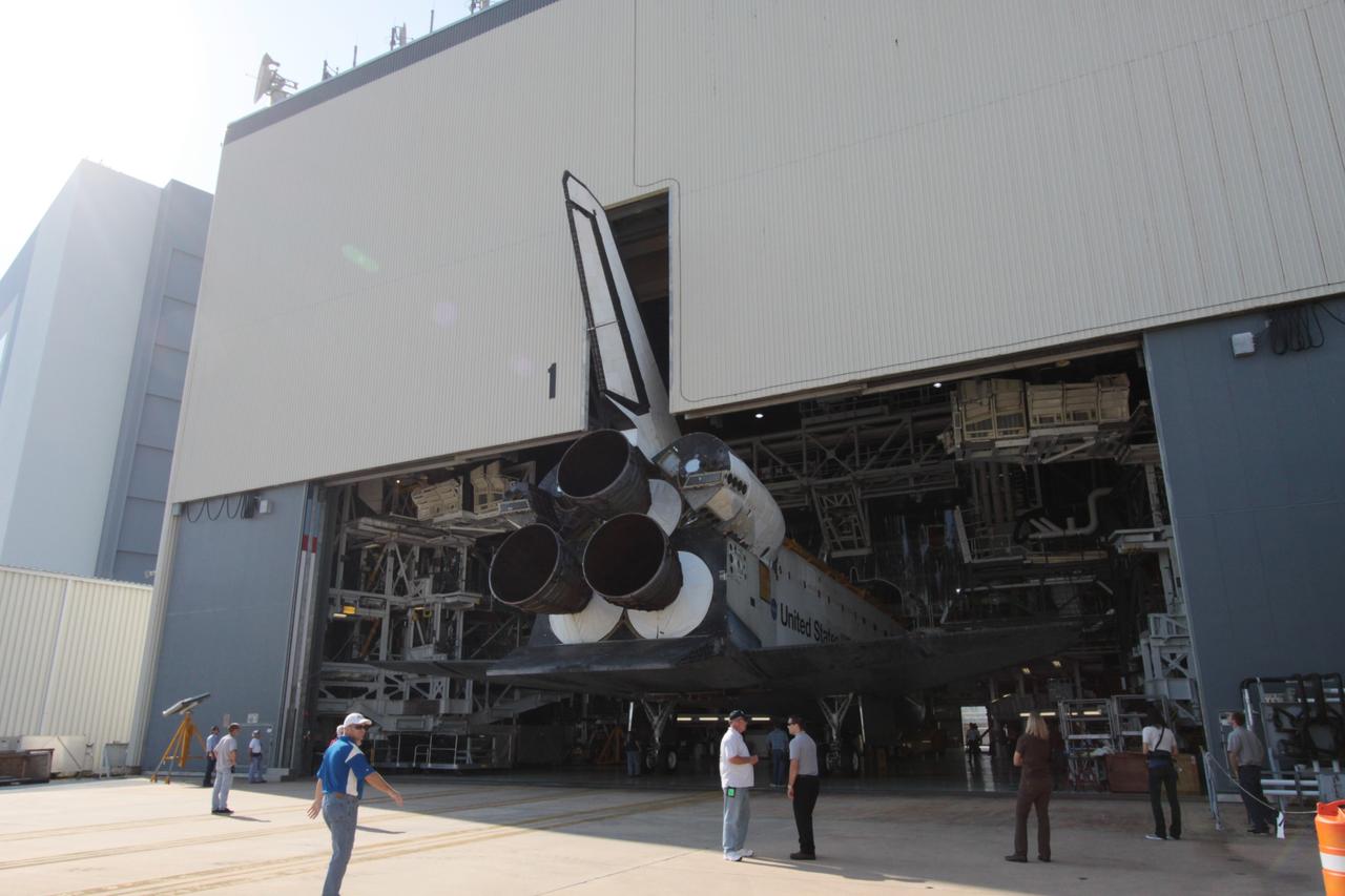 CAPE CANAVERAL, Fla. - At NASA's Kennedy Space Center in Florida, space shuttle Atlantis begins to emerge from Orbiter Processing Facility-1. The spacecraft moved into storage inside High Bay 4 of the nearby Vehicle Assembly Building. The work is part of the Space Shuttle Program's transition and retirement processing of the space shuttle fleet. A groundbreaking was held Jan. 18 for Atlantis' future home, a 65,000-square-foot exhibit hall in Shuttle Plaza at the Kennedy Space Center Visitor Complex. Atlantis is scheduled to roll over to the visitor complex in November in preparation for the exhibit's grand opening in July 2013. Photo credit: NASA/Jim Grossmann