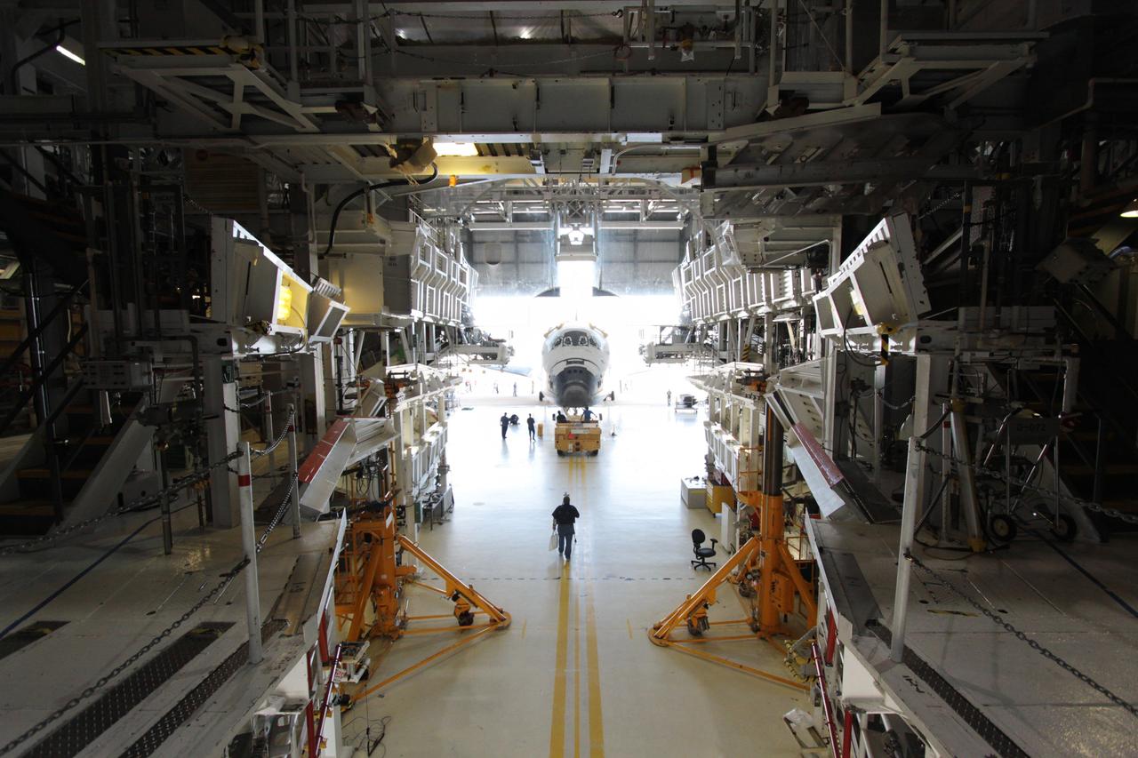 CAPE CANAVERAL, Fla. - At NASA's Kennedy Space Center in Florida, space shuttle Atlantis is awash in sunlight as it rolls out of Orbiter Processing Facility-1 on its way to High Bay 4 of the nearby Vehicle Assembly Building.     The work is part of the Space Shuttle Program's transition and retirement processing of the space shuttle fleet. A groundbreaking was held Jan. 18 for Atlantis' future home, a 65,000-square-foot exhibit hall in Shuttle Plaza at the Kennedy Space Center Visitor Complex. Atlantis is scheduled to roll over to the visitor complex in November in preparation for the exhibit's grand opening in July 2013. Photo credit: NASA/Jim Grossmann