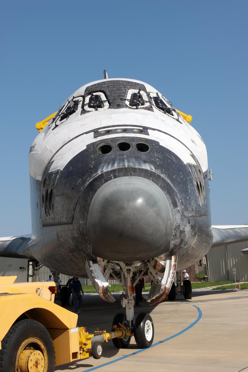 CAPE CANAVERAL, Fla. - The camera captures a nose-on view of space shuttle Atlantis as it is backed out of Orbiter Processing Facility Bay 1 for a move to High Bay 4 of the nearby Vehicle Assembly Building at NASA's Kennedy Space Center in Florida.    The work is part of the Space Shuttle Program's transition and retirement processing of the space shuttle fleet. A groundbreaking was held Jan. 18 for Atlantis' future home, a 65,000-square-foot exhibit hall in Shuttle Plaza at the Kennedy Space Center Visitor Complex. Atlantis is scheduled to roll over to the visitor complex in November in preparation for the exhibit's grand opening in July 2013. For more information, visit http://www.nasa.gov/transition. Photo credit: NASA/Jim Grossmann
