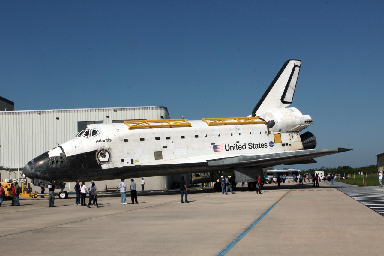 CAPE CANAVERAL, Fla. - Space shuttle Atlantis moves out of Orbiter Processing Facility-1 at NASA's Kennedy Space Center in Florida, beginning to short move to High Bay 4 of the nearby Vehicle Assembly Building. The work is part of the Space Shuttle Program's transition and retirement processing of the space shuttle fleet. A groundbreaking was held Jan. 18 for Atlantis' future home, a 65,000-square-foot exhibit hall in Shuttle Plaza at the Kennedy Space Center Visitor Complex. Atlantis is scheduled to roll over to the visitor complex in November in preparation for the exhibit's grand opening in July 2013. Photo credit: NASA/Jim Grossmann
