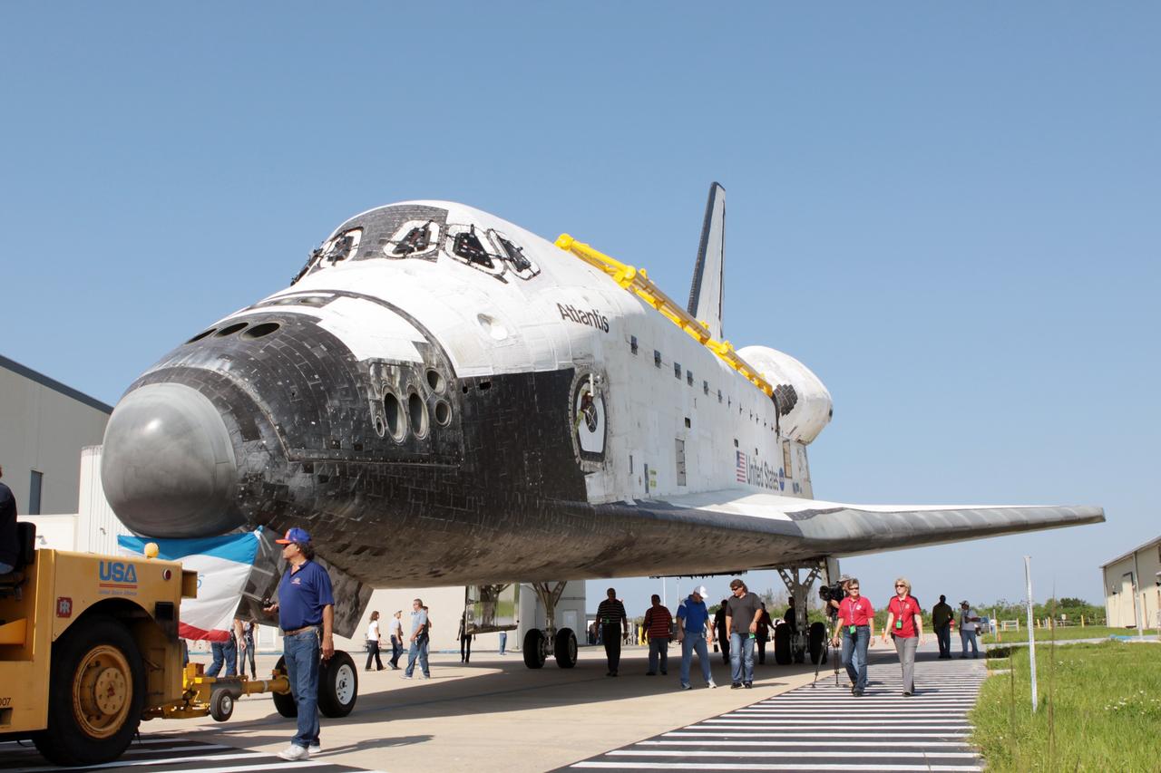 CAPE CANAVERAL, Fla. - Space shuttle Atlantis begins its move from Orbiter Processing Facility Bay 1. The spacecraft is being moved into storage inside High Bay 4 of the nearby Vehicle Assembly Building at NASA's Kennedy Space Center in Florida.    The work is part of the Space Shuttle Program's transition and retirement processing of the space shuttle fleet. A groundbreaking was held Jan. 18 for Atlantis' future home, a 65,000-square-foot exhibit hall in Shuttle Plaza at the Kennedy Space Center Visitor Complex. Atlantis is scheduled to roll over to the visitor complex in November in preparation for the exhibit's grand opening in July 2013. For more information, visit http://www.nasa.gov/transition. Photo credit: NASA/Jim Grossmann