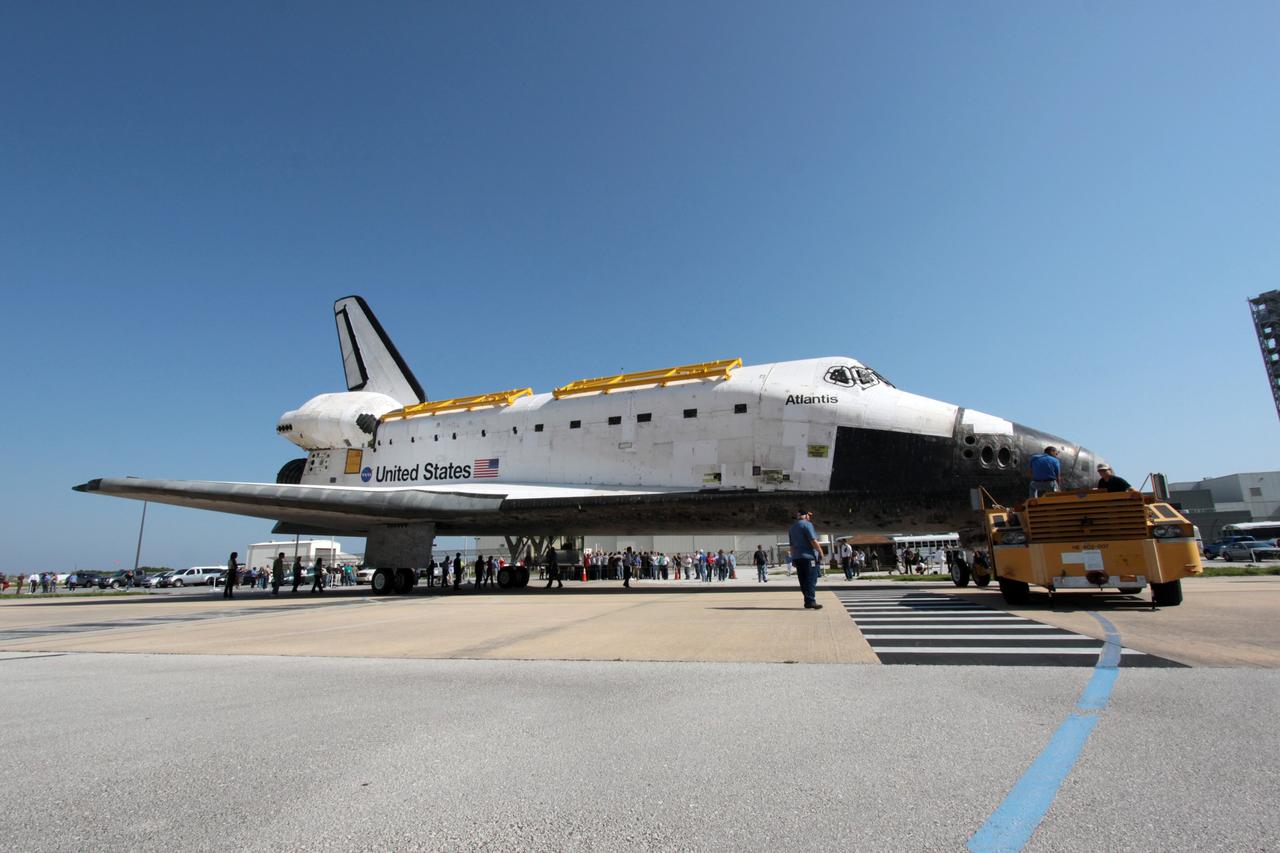 CAPE CANAVERAL, Fla. - Space shuttle Atlantis moves out of Orbiter Processing Facility Bay 1 at NASA's Kennedy Space Center in Florida beginning its short move to High Bay 4 of the nearby Vehicle Assembly Building.    The work is part of the Space Shuttle Program's transition and retirement processing of the space shuttle fleet. A groundbreaking was held Jan. 18 for Atlantis' future home, a 65,000-square-foot exhibit hall in Shuttle Plaza at the Kennedy Space Center Visitor Complex. Atlantis is scheduled to roll over to the visitor complex in November in preparation for the exhibit's grand opening in July 2013. For more information, visit http://www.nasa.gov/transition. Photo credit: NASA/Jim Grossmann