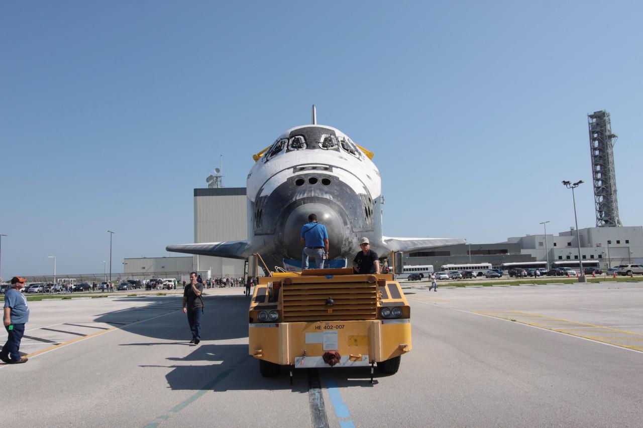 CAPE CANAVERAL, Fla. - Technicians tow space shuttle Atlantis into High Bay 4 of the Vehicle Assembly Building after a short move from Orbiter Processing Facility Bay 1 at NASA's Kennedy Space Center.    The work is part of the Space Shuttle Program's transition and retirement processing of the space shuttle fleet. A groundbreaking was held Jan. 18 for Atlantis' future home, a 65,000-square-foot exhibit hall in Shuttle Plaza at the Kennedy Space Center Visitor Complex. Atlantis is scheduled to roll over to the visitor complex in November in preparation for the exhibit's grand opening in July 2013. For more information, visit http://www.nasa.gov/transition. Photo credit: NASA/Jim Grossmann