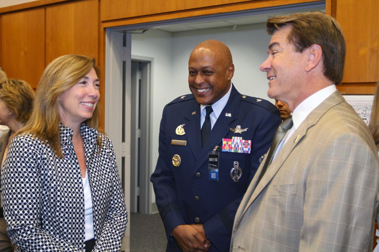 CAPE CANAVERAL, Fla. – NASA Deputy Director Lori Garver, left, participates in an event marking the arrival of NASA's first space-bound Orion capsule at NASA's Kennedy Space Center in Florida. Talking to Garver in Kennedy's Operations and Checkout Building Mission Briefing Room are, from left, Brig. Gen. Anthony J. Cotton, commander of the 45th Space Wing, and Florida Senator Thad Altman. Slated for Exploration Flight Test-1, an uncrewed mission planned for 2014, the capsule will travel farther into space than any human spacecraft has gone in more than 40 years. The capsule was shipped to Kennedy from NASA's Michoud Assembly Facility in New Orleans where the crew module pressure vessel was built. The Orion production team will prepare the module for flight at Kennedy by installing heat-shielding thermal protection systems, avionics and other subsystems. For more information, visit http://www.nasa.gov/orion. Photo credit: NASA/Kim Shiflett