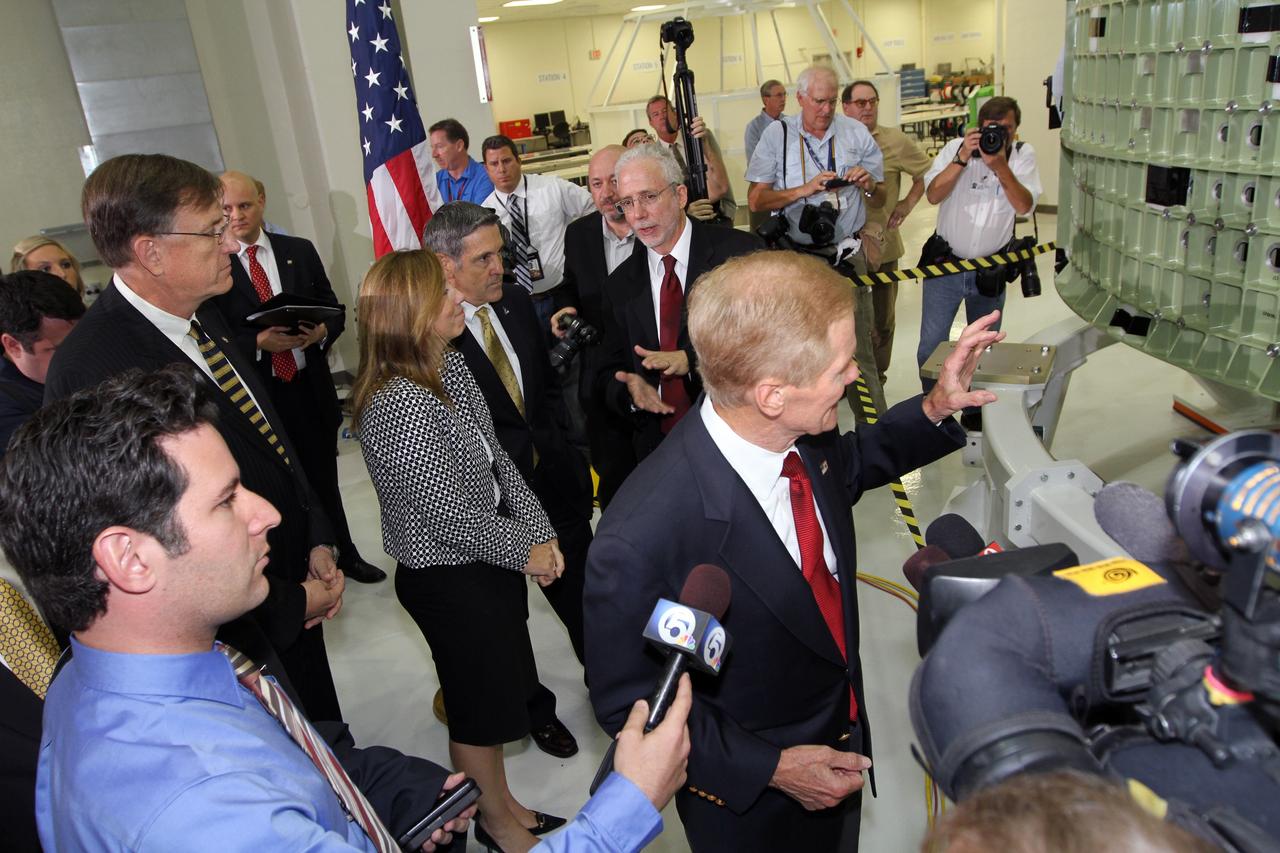 CAPE CANAVERAL, Fla. – U.S. Senator Bill Nelson, right, takes questions from the media in Kennedy Space Center's Operations and Checkout Building high bay following an event marking the arrival in Florida of NASA's first space-bound Orion capsule.  Behind Nelson are, from left, Dan Dumbacher, NASA deputy associate administrator for Exploration Systems Development, NASA Deputy Director Lori Garver, Kennedy Space Center Director Robert Cabana and Mark Geyer, Orion program manager.    Slated for Exploration Flight Test-1, an uncrewed mission planned for 2014, the capsule will travel farther into space than any human spacecraft has gone in more than 40 years. The capsule was shipped to Kennedy from NASA's Michoud Assembly Facility in New Orleans where the crew module pressure vessel was built. The Orion production team will prepare the module for flight at Kennedy by installing heat-shielding thermal protection systems, avionics and other subsystems. For more information, visit http://www.nasa.gov/orion.  Photo credit: NASA/Kim Shiflett