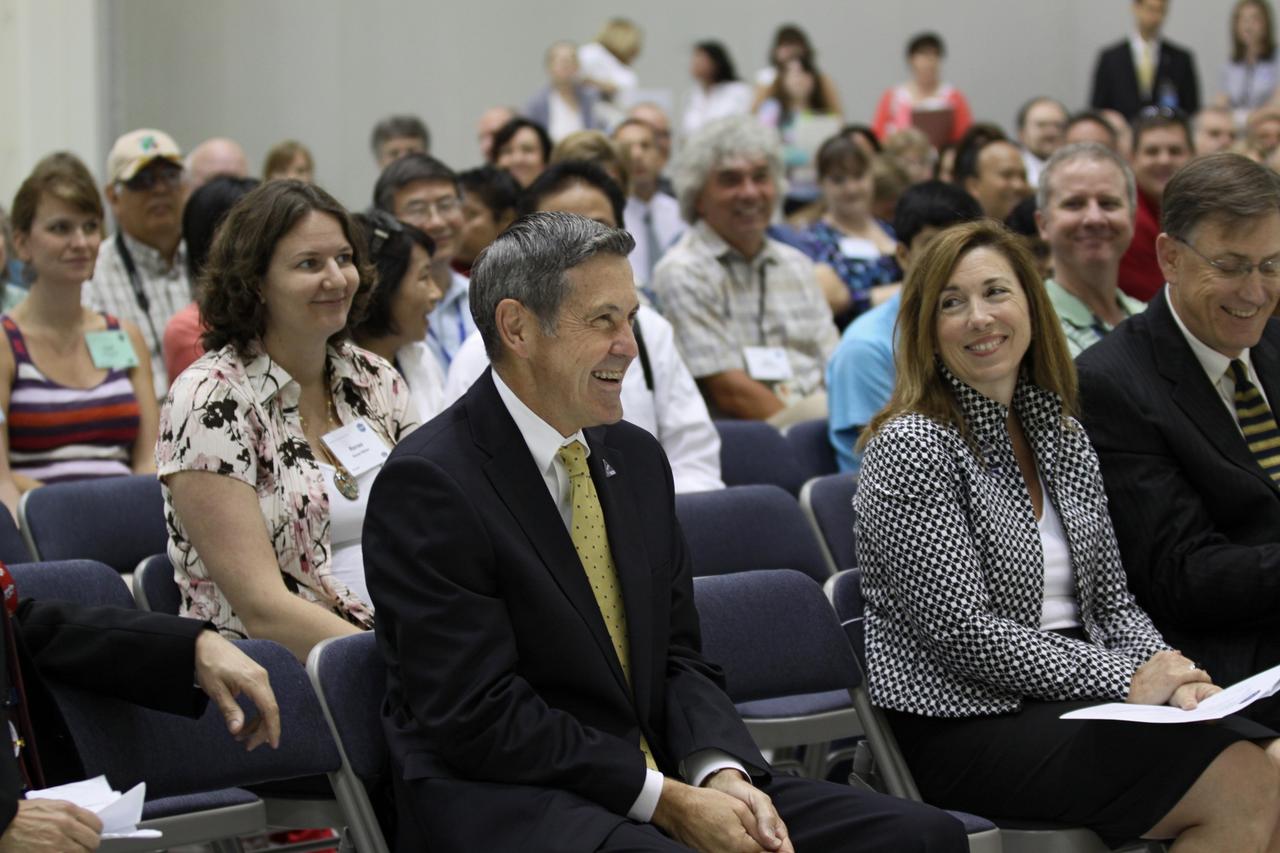 CAPE CANAVERAL, Fla. – NASA dignitaries await their turns at the podium in Kennedy Space Center's Operations and Checkout Building high bay during an event marking the arrival of NASA's first space-bound Orion capsule in Florida.  From left are Kennedy's Director Robert Cabana, NASA Deputy Administrator Lori Garver and Dan Dumbacher, NASA deputy associate administrator for Exploration Systems Development.     Slated for Exploration Flight Test-1, an uncrewed mission planned for 2014, the capsule will travel farther into space than any human spacecraft has gone in more than 40 years. The capsule was shipped to Kennedy from NASA's Michoud Assembly Facility in New Orleans where the crew module pressure vessel was built. The Orion production team will prepare the module for flight at Kennedy by installing heat-shielding thermal protection systems, avionics and other subsystems. For more information, visit http://www.nasa.gov/orion.  Photo credit: NASA/Kim Shiflett
