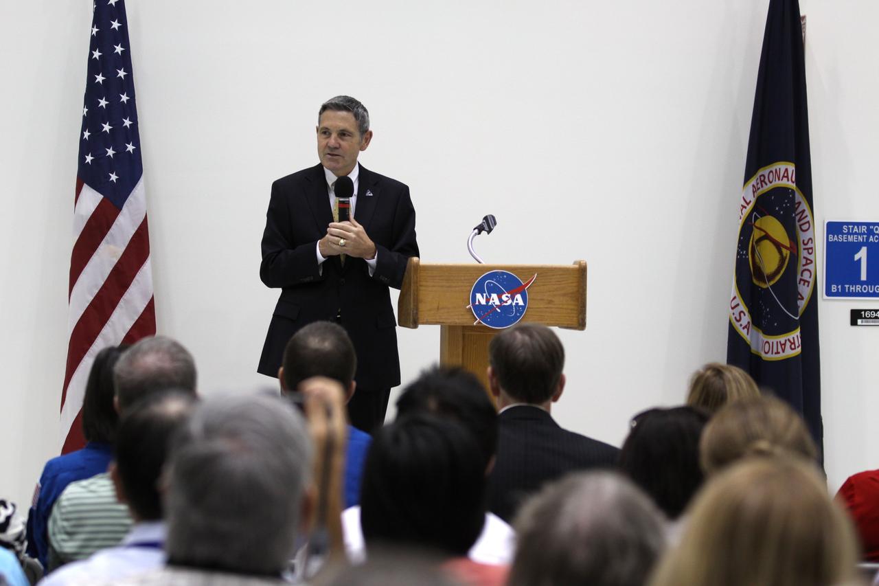 CAPE CANAVERAL, Fla. – NASA Kennedy Space Center Director Robert Cabana addresses the audience assembled in Kennedy's Operations and Checkout Building high bay for an event marking the arrival of NASA's first space-bound Orion capsule in Florida.    Slated for Exploration Flight Test-1, an uncrewed mission planned for 2014, the capsule will travel farther into space than any human spacecraft has gone in more than 40 years. The capsule was shipped to Kennedy from NASA's Michoud Assembly Facility in New Orleans where the crew module pressure vessel was built. The Orion production team will prepare the module for flight at Kennedy by installing heat-shielding thermal protection systems, avionics and other subsystems. For more information, visit http://www.nasa.gov/orion.  Photo credit: NASA/Kim Shiflett