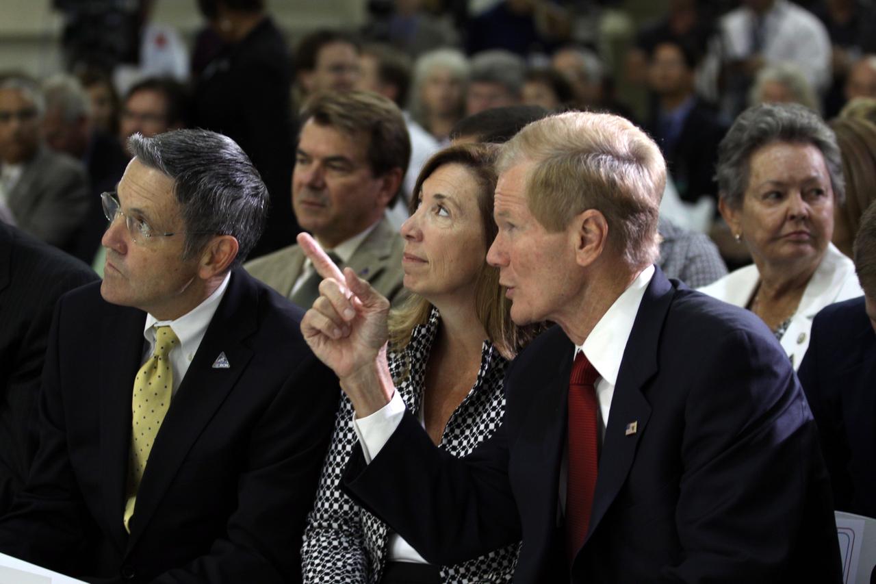 CAPE CANAVERAL, Fla. – From left, NASA Kennedy Space Center Director Robert Cabana, NASA Deputy Administrator Lori Garver and U.S. Senator Bill Nelson participate in an event in Kennedy's Operations and Checkout Building high bay marking the arrival of NASA's first space-bound Orion capsule in Florida.    Slated for Exploration Flight Test-1, an uncrewed mission planned for 2014, the capsule will travel farther into space than any human spacecraft has gone in more than 40 years. The capsule was shipped to Kennedy from NASA's Michoud Assembly Facility in New Orleans where the crew module pressure vessel was built. The Orion production team will prepare the module for flight at Kennedy by installing heat-shielding thermal protection systems, avionics and other subsystems. For more information, visit http://www.nasa.gov/orion.  Photo credit: NASA/Kim Shiflett