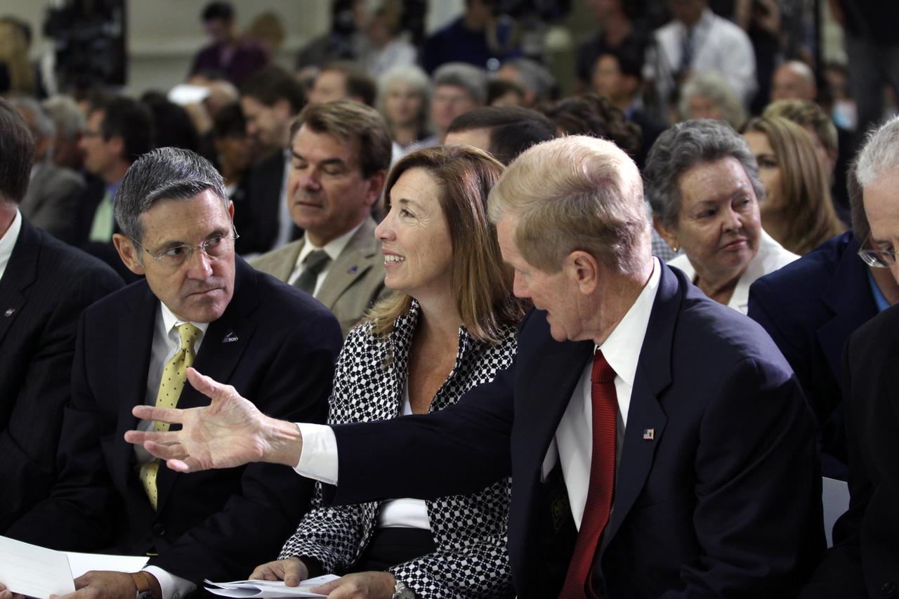 CAPE CANAVERAL, Fla. – From left, NASA Kennedy Space Center Director Robert Cabana, NASA Deputy Administrator Lori Garver and U.S. Senator Bill Nelson participate in an event in Kennedy's Operations and Checkout Building high bay marking the arrival of NASA's first space-bound Orion capsule in Florida.    Slated for Exploration Flight Test-1, an uncrewed mission planned for 2014, the capsule will travel farther into space than any human spacecraft has gone in more than 40 years. The capsule was shipped to Kennedy from NASA's Michoud Assembly Facility in New Orleans where the crew module pressure vessel was built. The Orion production team will prepare the module for flight at Kennedy by installing heat-shielding thermal protection systems, avionics and other subsystems. For more information, visit http://www.nasa.gov/orion.  Photo credit: NASA/Kim Shiflett