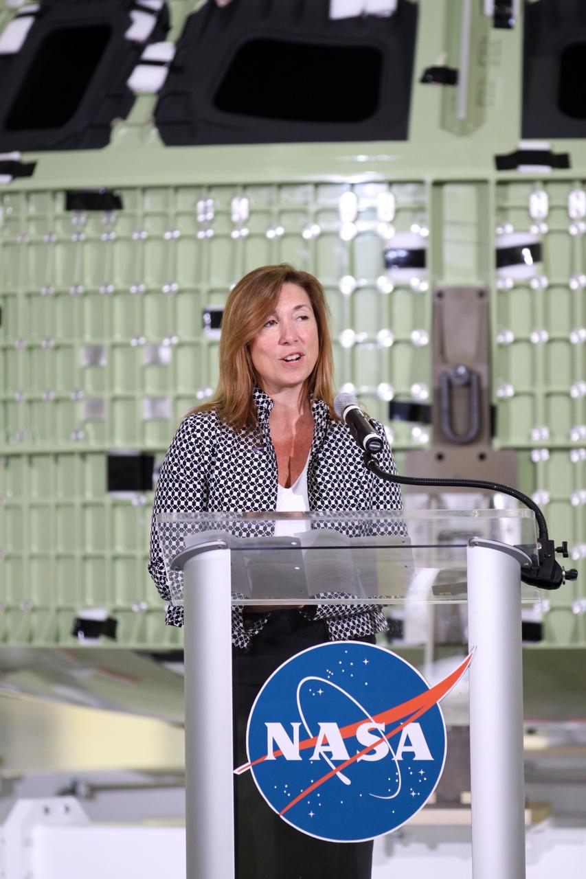 CAPE CANAVERAL, Fla. – NASA Deputy Administrator Lori Garver addresses the audience assembled in Kennedy Space Center's Operations and Checkout Building high bay for an event marking the arrival of NASA's first space-bound Orion capsule in Florida.    Slated for Exploration Flight Test-1, an uncrewed mission planned for 2014, the capsule will travel farther into space than any human spacecraft has gone in more than 40 years. The capsule was shipped to Kennedy from NASA's Michoud Assembly Facility in New Orleans where the crew module pressure vessel was built. The Orion production team will prepare the module for flight at Kennedy by installing heat-shielding thermal protection systems, avionics and other subsystems. For more information, visit http://www.nasa.gov/orion.  Photo credit: NASA/Kim Shiflett